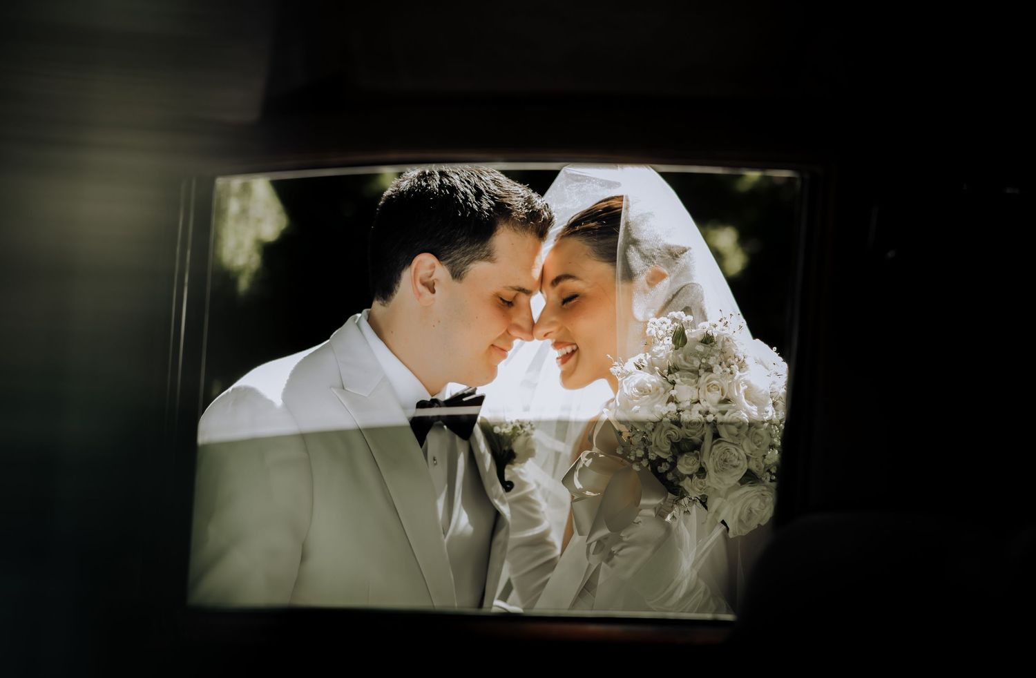 A sequence of romantic wedding moments captured through a car window.