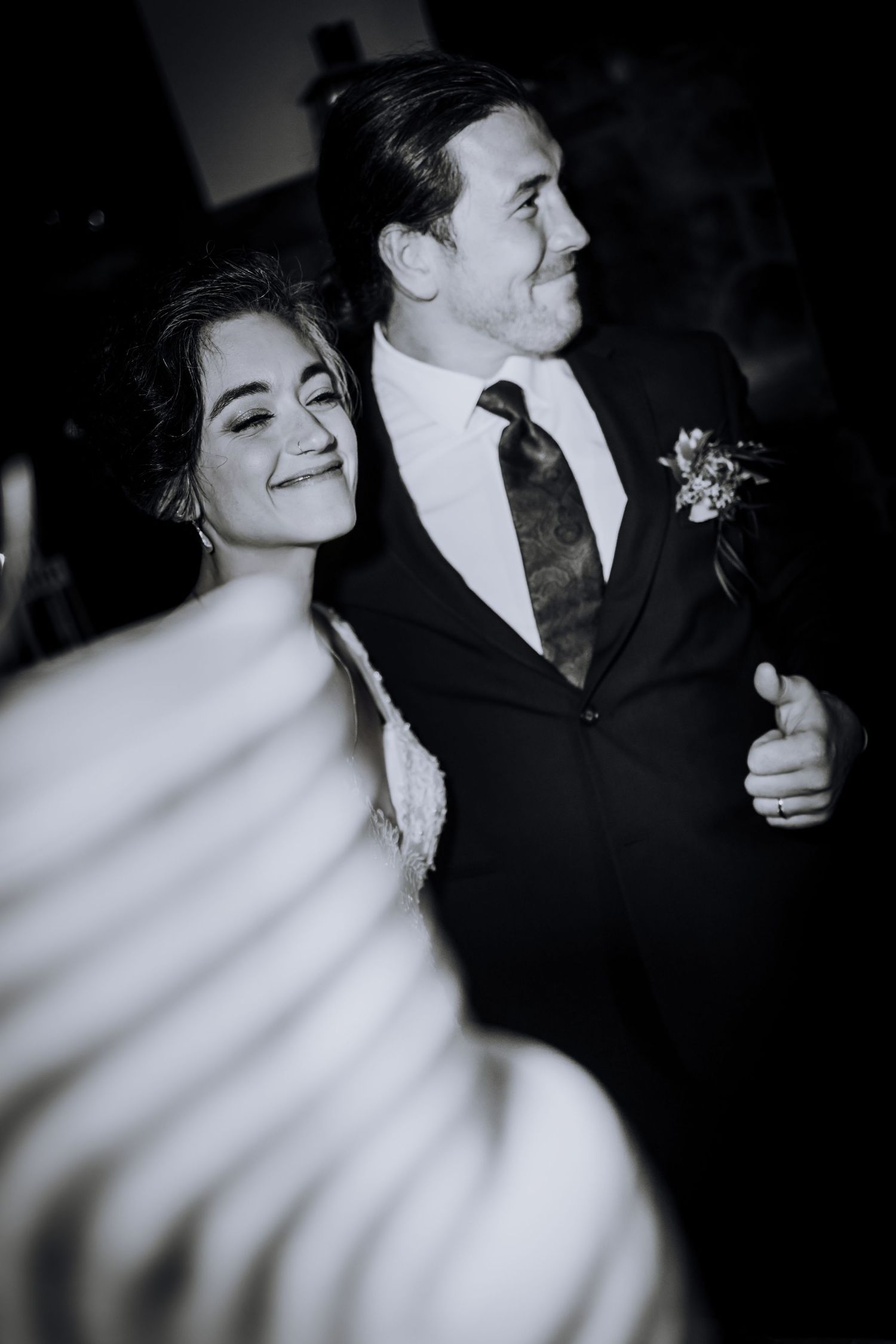 Black and white artistic wedding portraits with dramatic lighting and shadows.
