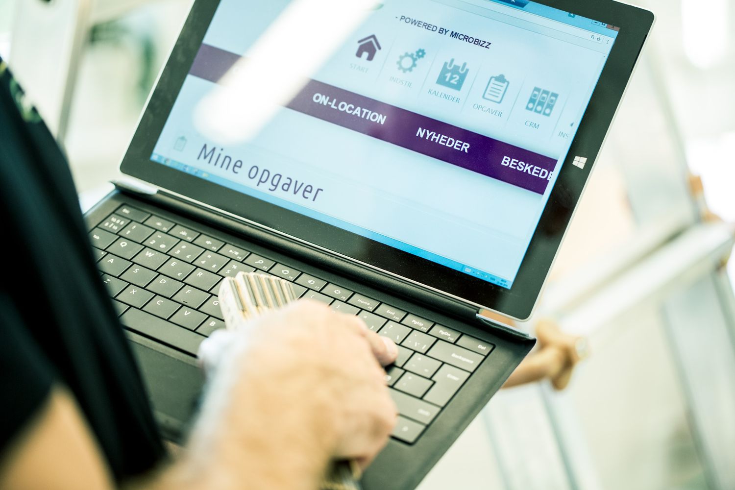 Tablet displaying software interface for technical systems management.
