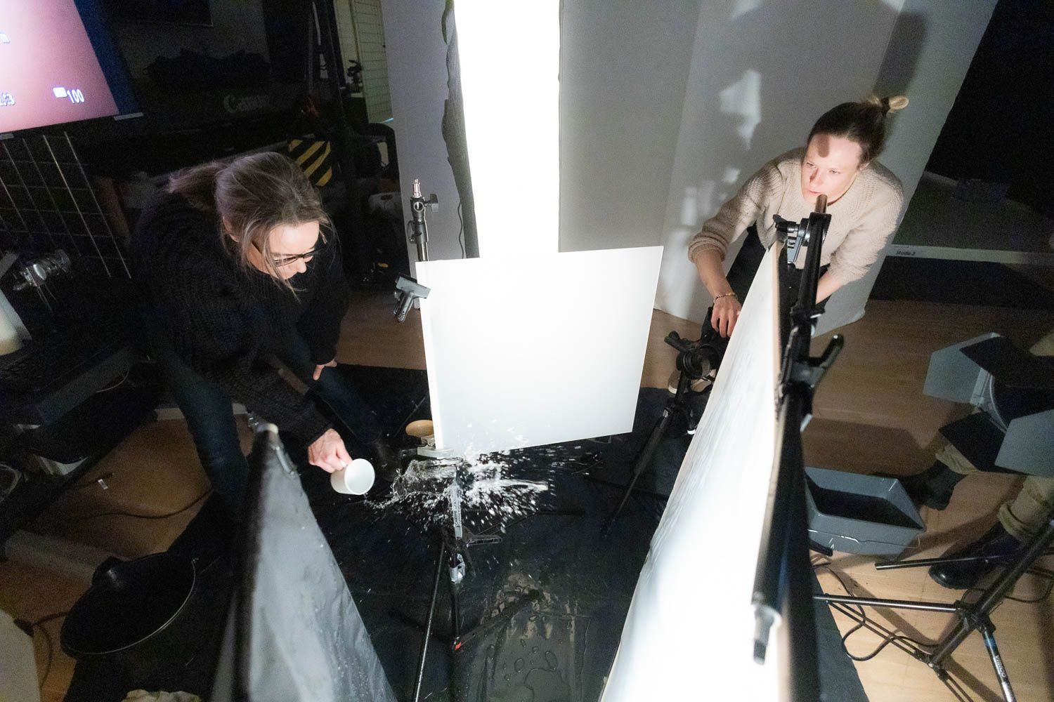 Professional photography studio setup with lighting equipment and backdrops.