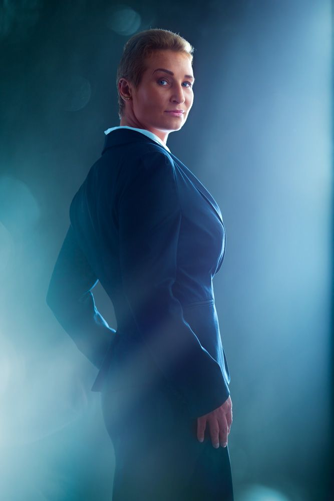 Dramatic silhouette portraits with blue backlighting and professional poses.