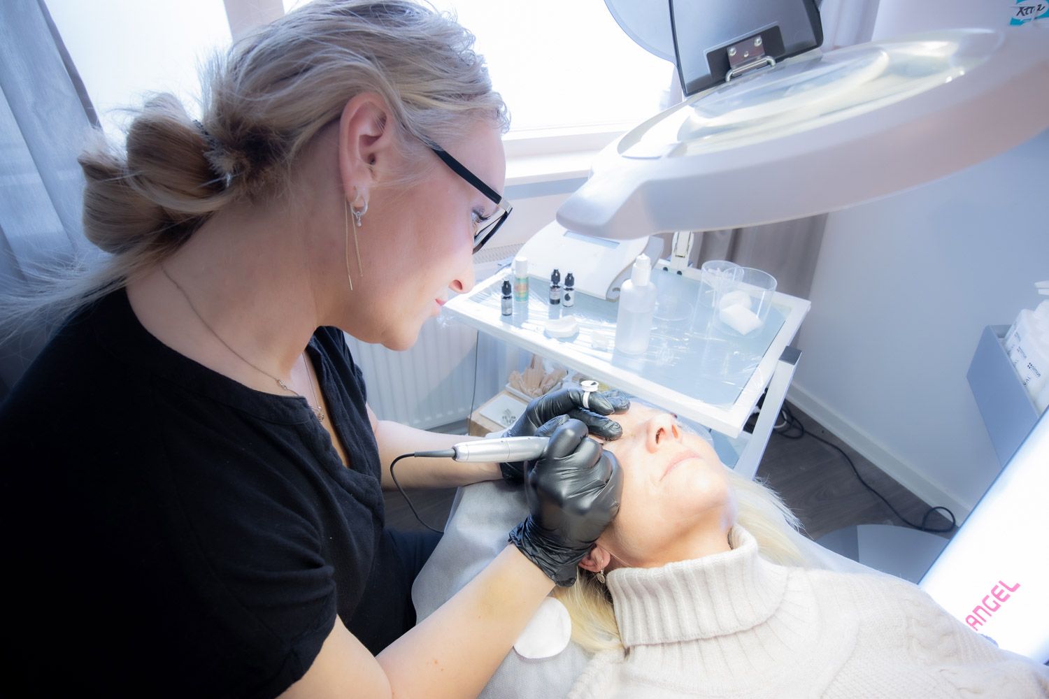 Professional beauty treatment session in progress at a bright medical spa.