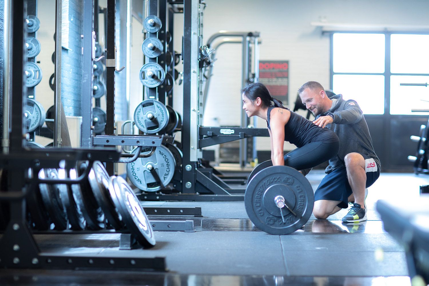 Clean, well-lit fitness facility featuring modern exercise equipment and training areas.
