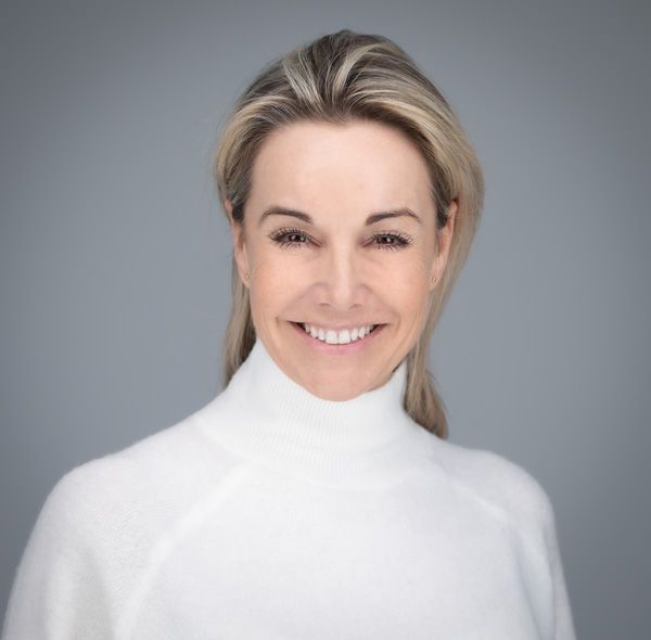 Portrait series of a person wearing a white turtleneck sweater against a grey backdrop.