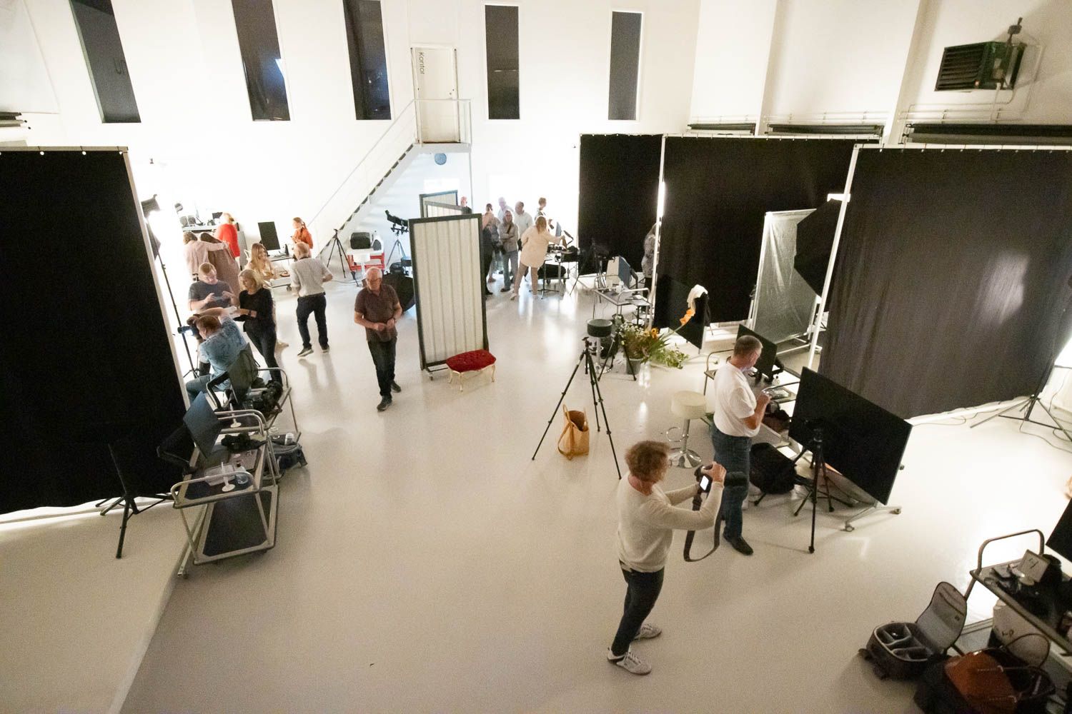 Overhead view of photography studio floor showing equipment placement and lighting setup.