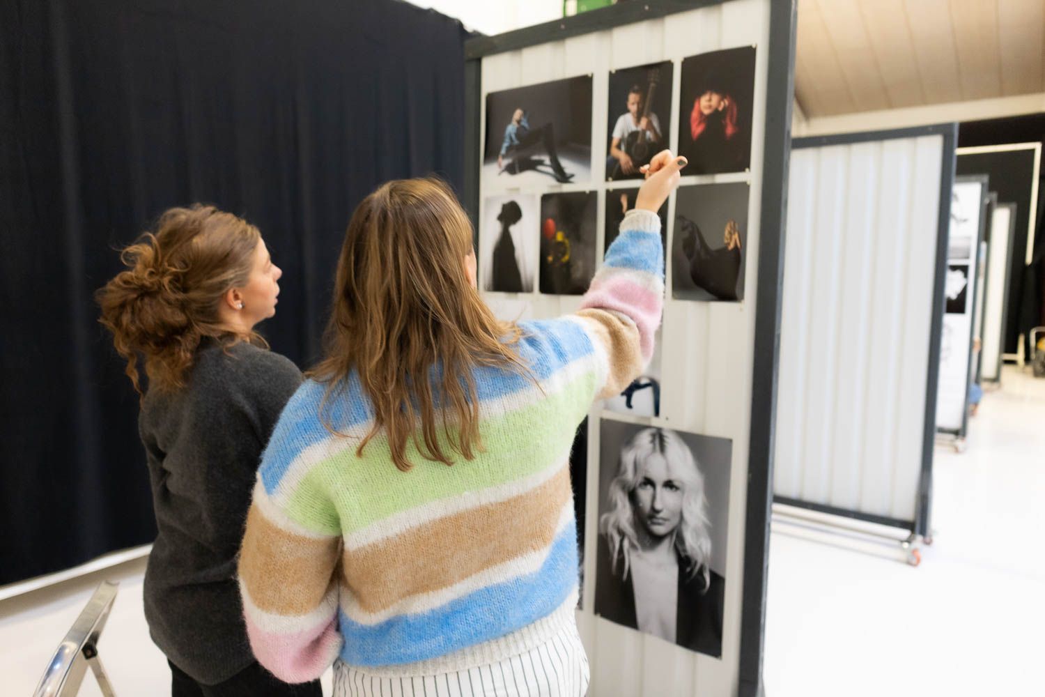 Art gallery hallway showing mounted photographs and exhibition space.