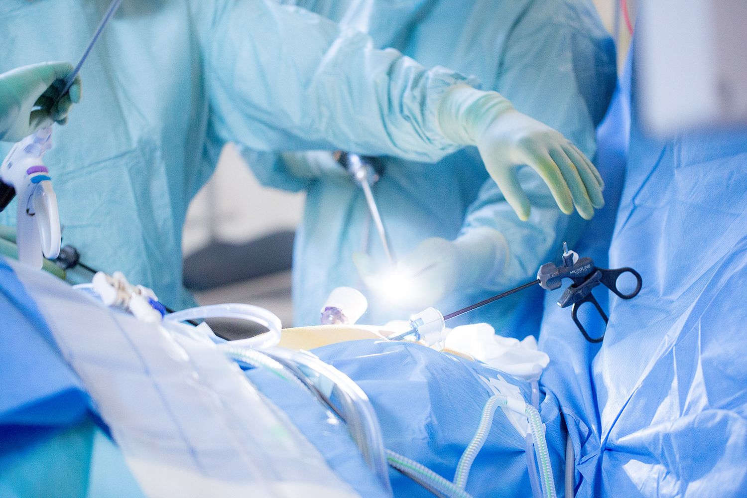 Surgeons working together during operation in hospital operating theater.