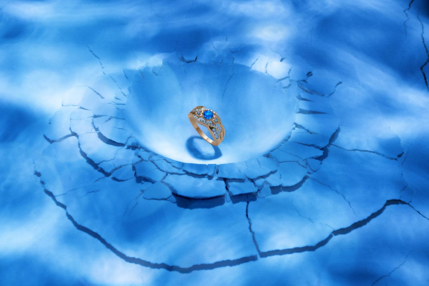 Abstract blue swirls and patterns create a dynamic flowing design against a bright background.