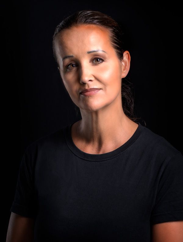 Close-up portraits showing person in black shirt with dramatic lighting.