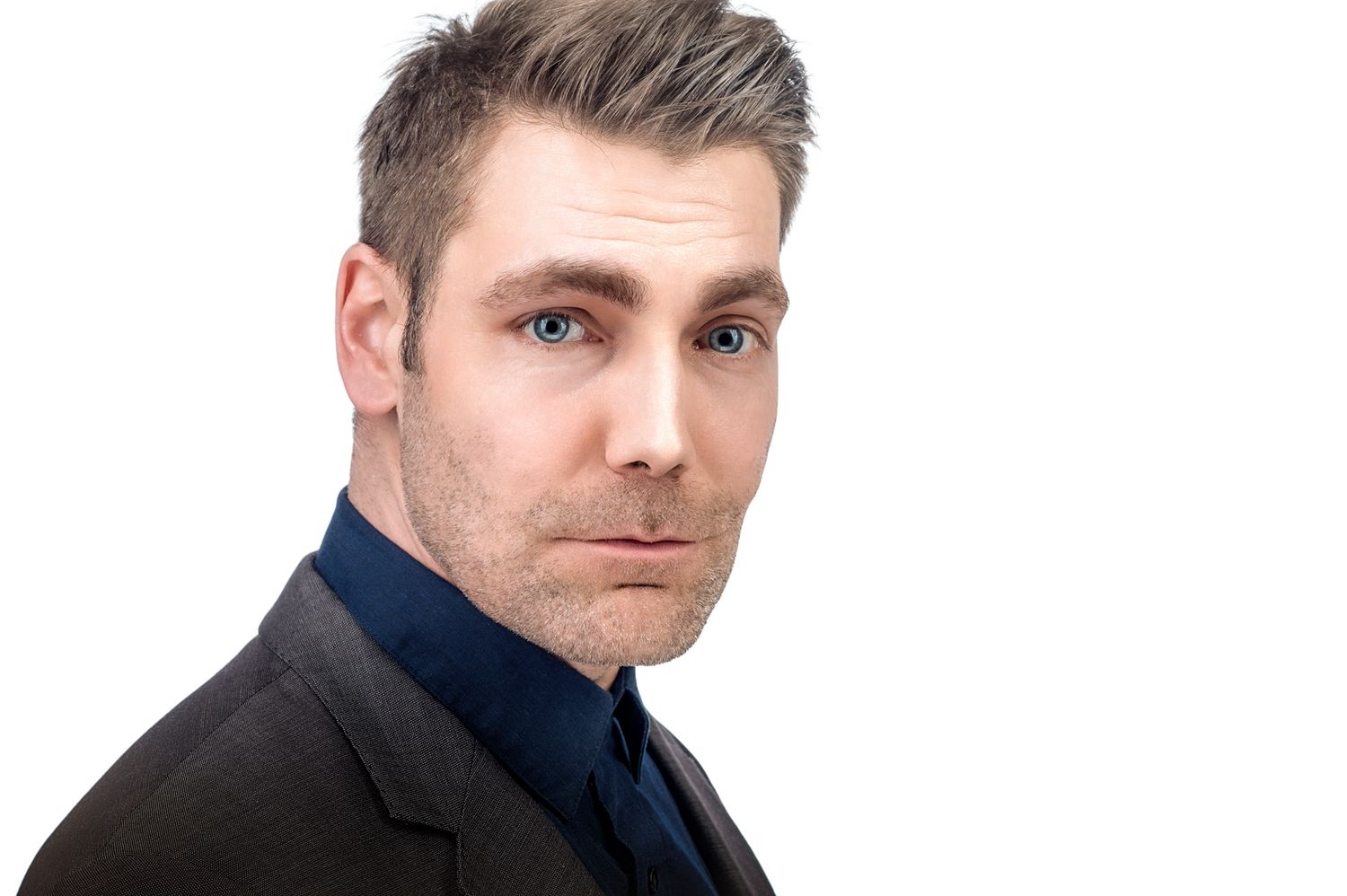 Professional headshot series showing different poses and expressions.