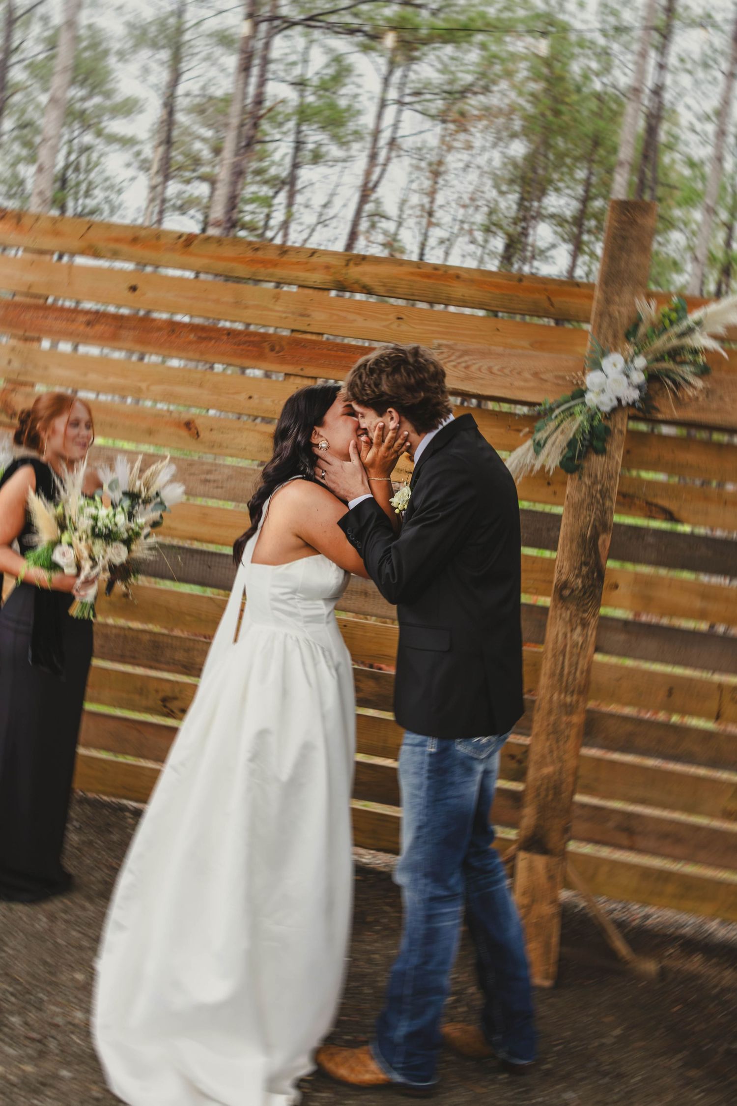A series of photos showing a couple dancing together in front of a wooden fence outdoors.