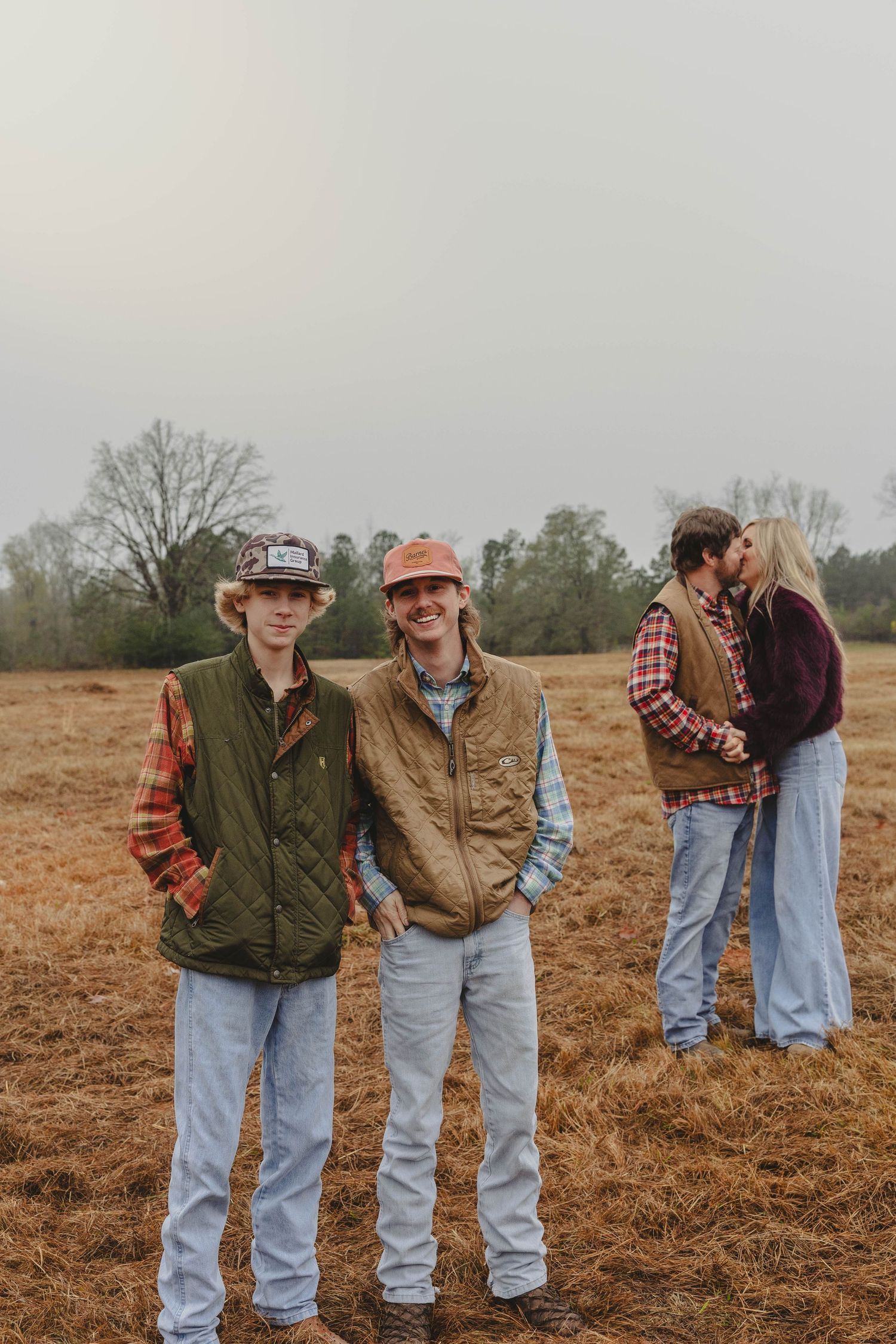 A series of romantic country-style photos showing couples in casual western wear standing together in a rustic field.
