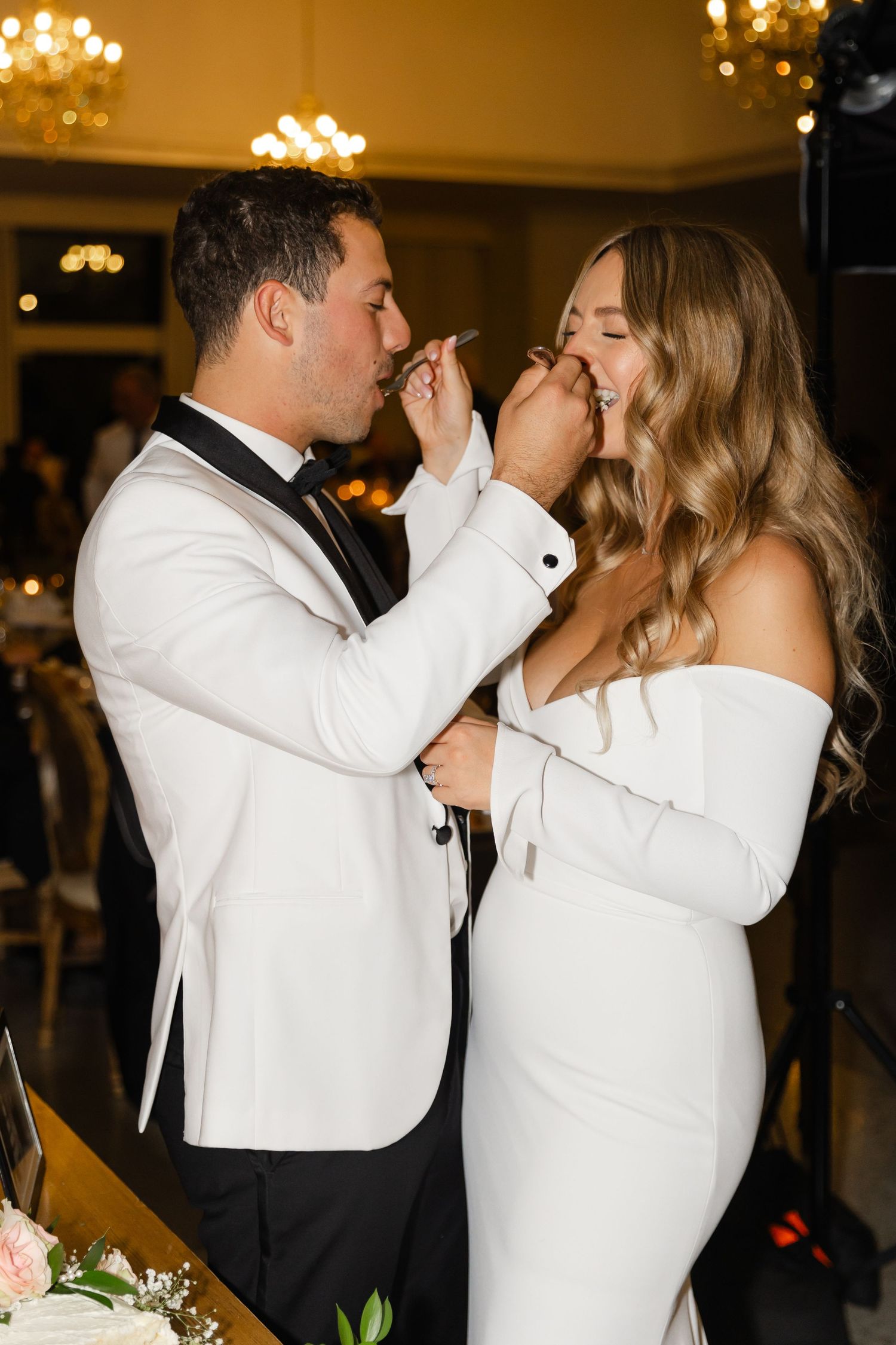 Couple sharing an intimate moment during their wedding reception.