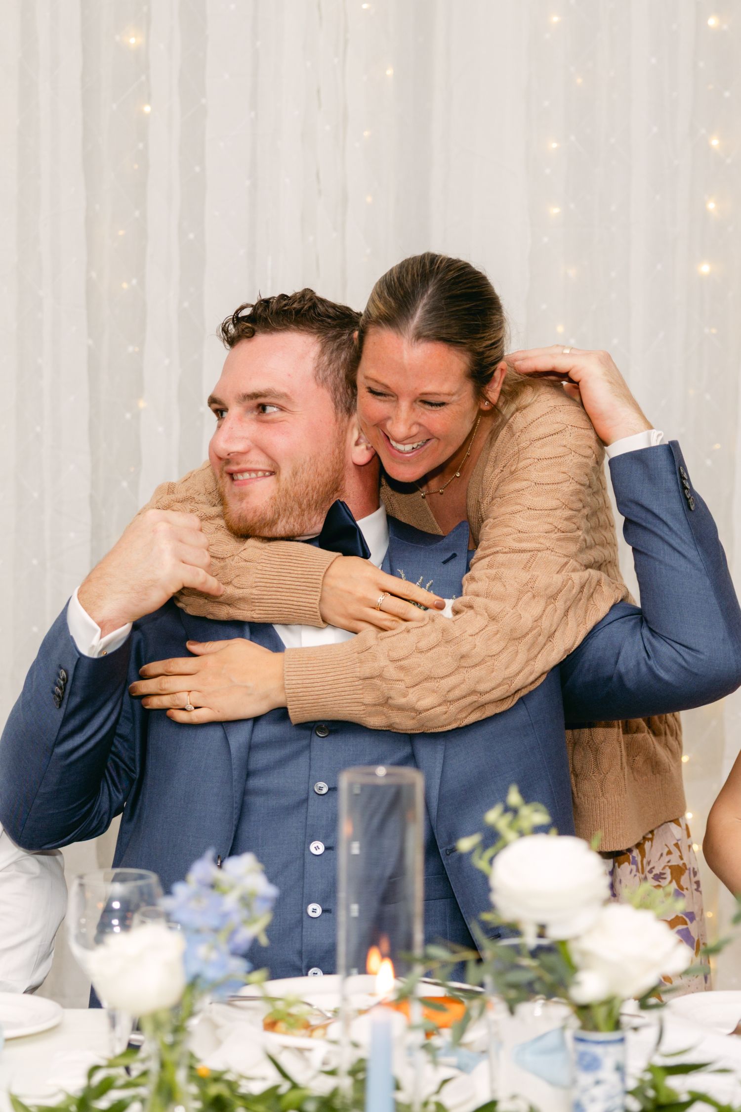 Emotional moment shared between guests during wedding reception speeches.