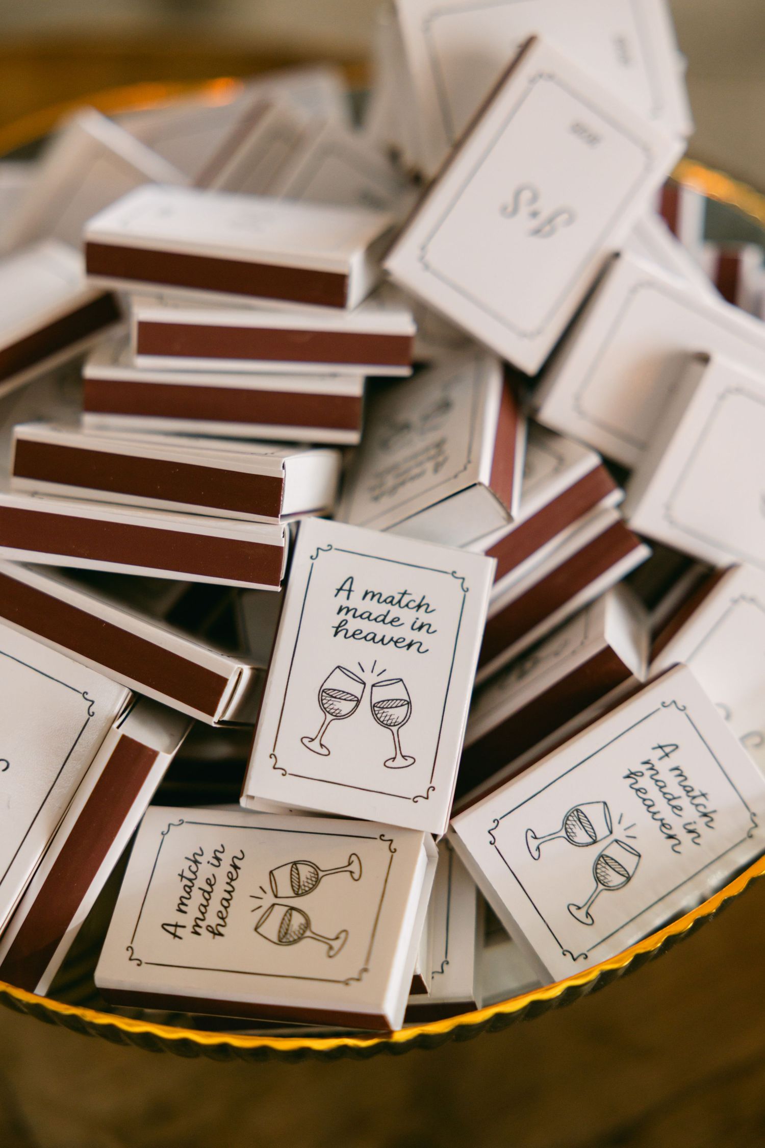 Collection of small paper cards with wine glass illustrations scattered on a surface.