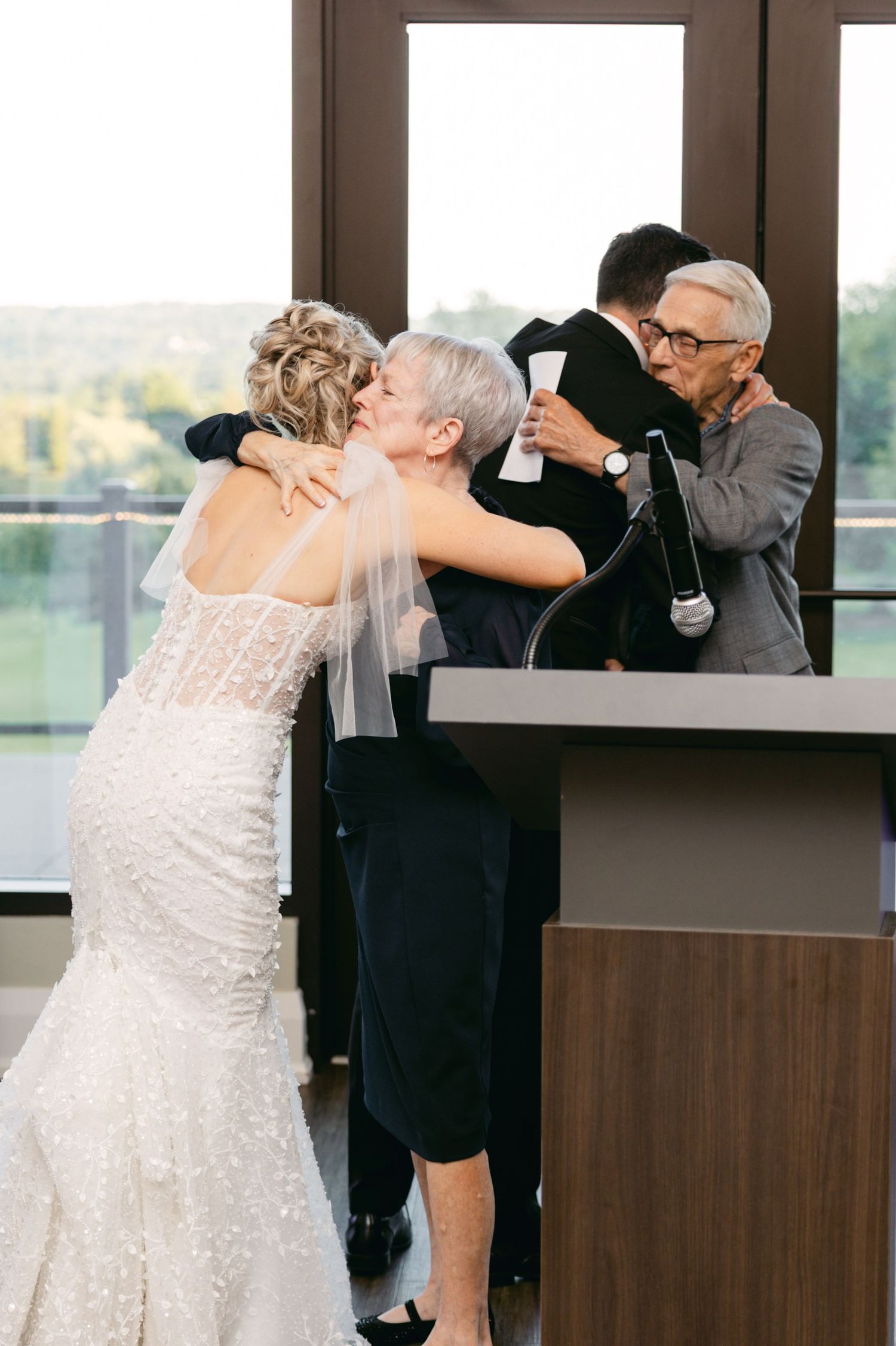 Joyful dancing and celebration moments during indoor wedding reception.