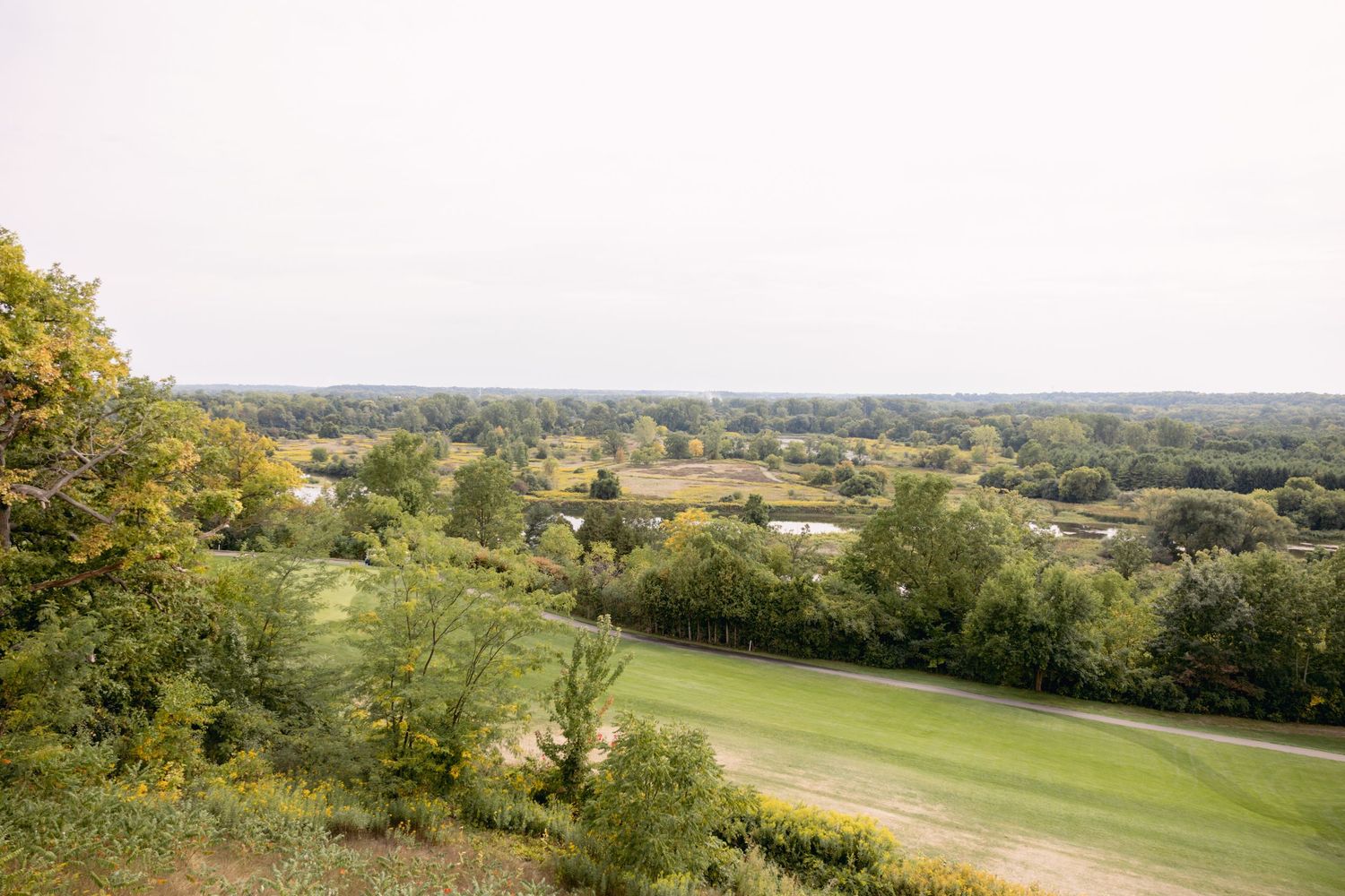 Scenic rolling hills and countryside landscape view from elevated position.