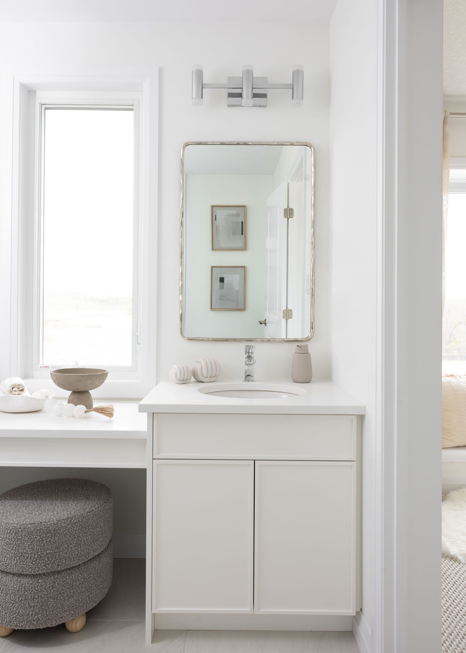 Modern white bathroom vanity with minimalist design and storage cabinets shown from multiple angles.