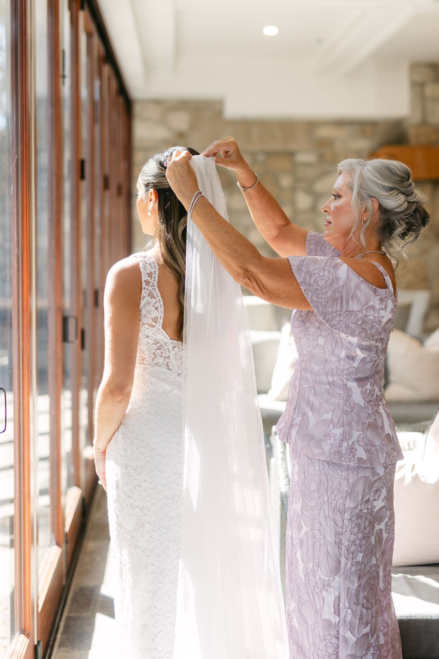 Side by side sequence showing two women dancing in formal dresses.