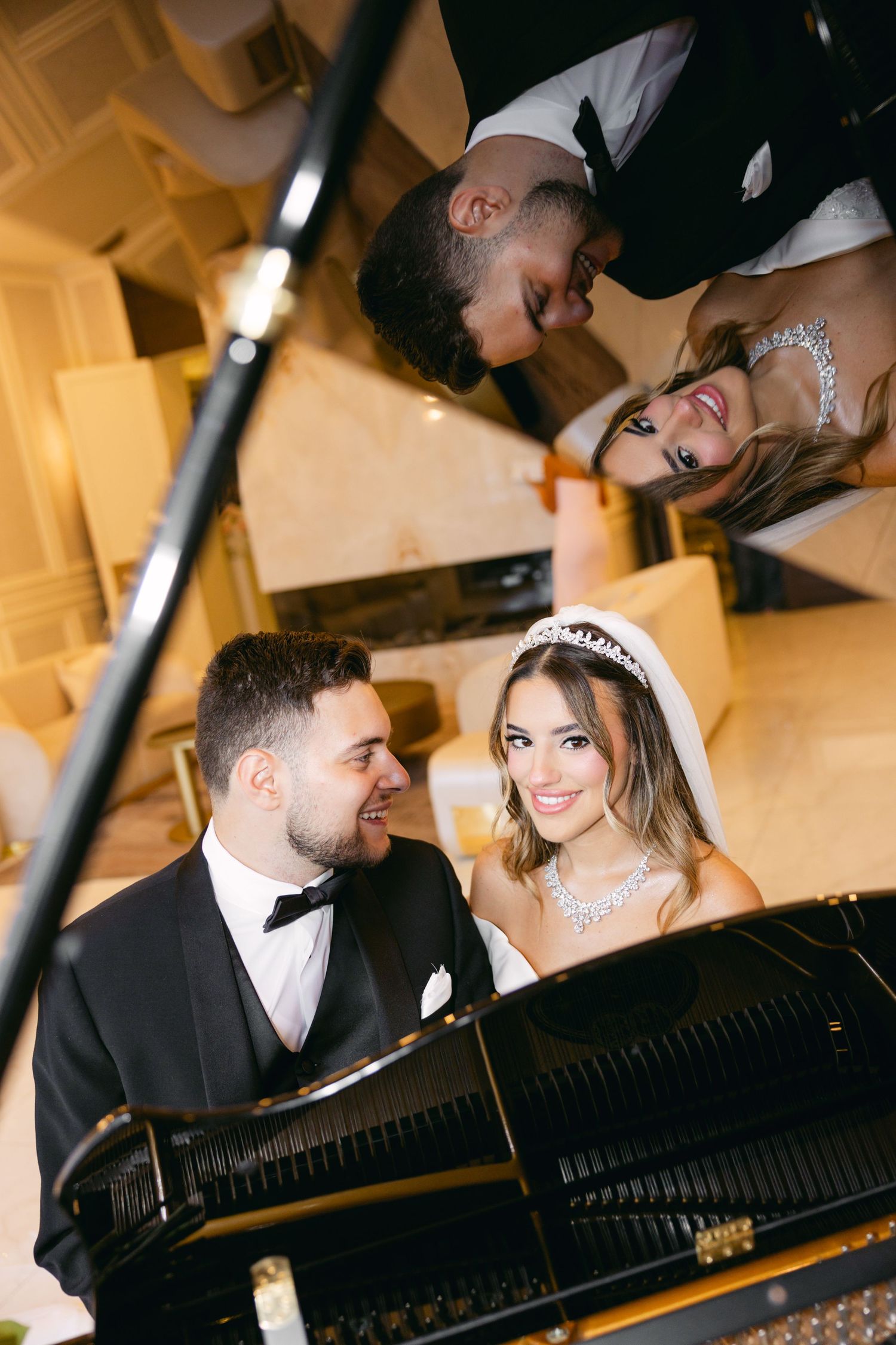 Intimate wedding portraits captured around a grand piano with warm lighting and elegant decor.