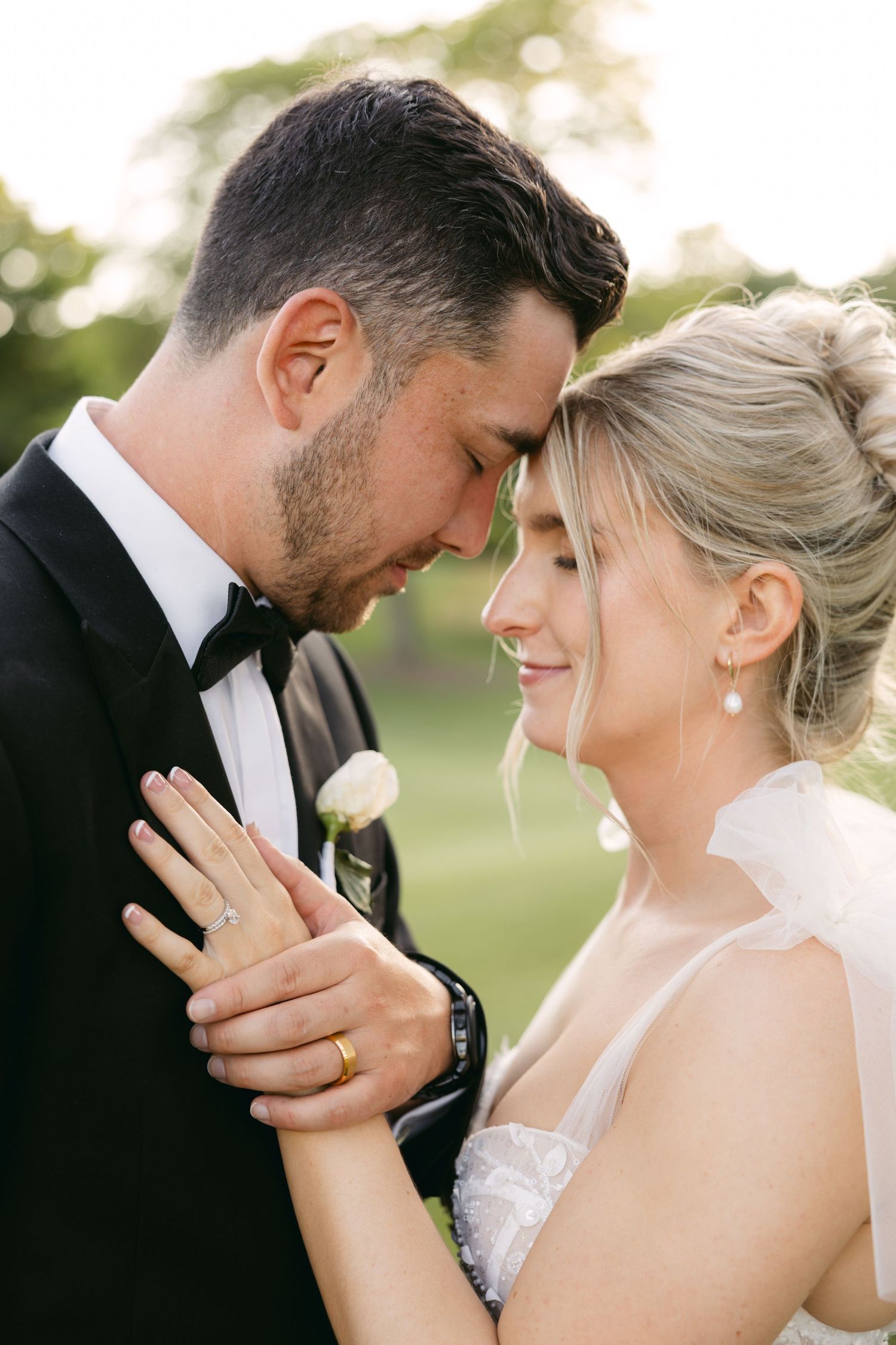 Intimate close-up wedding portraits showing tender moments and genuine emotions.