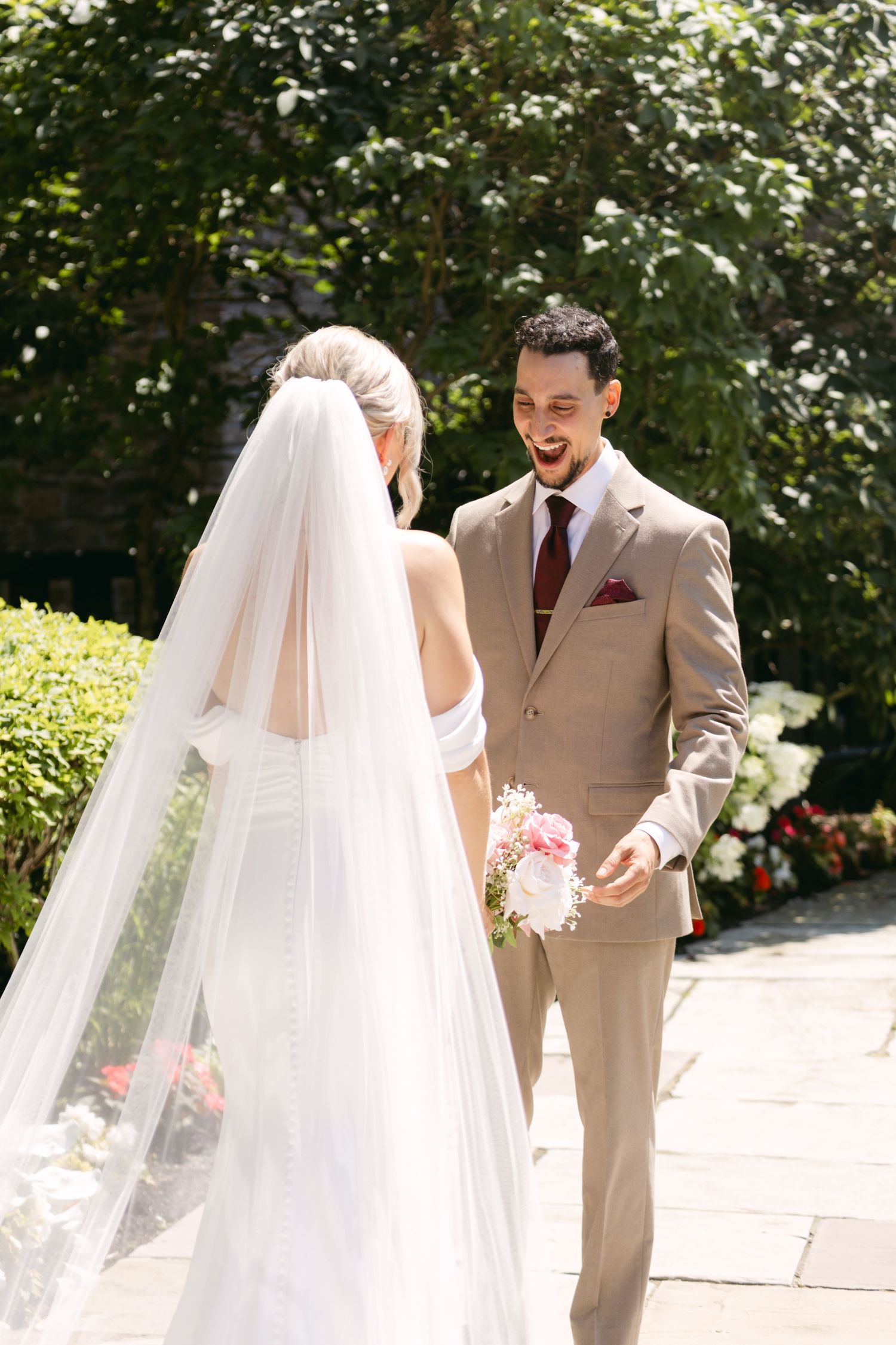 Joyful wedding moment captured between couple during outdoor ceremony.