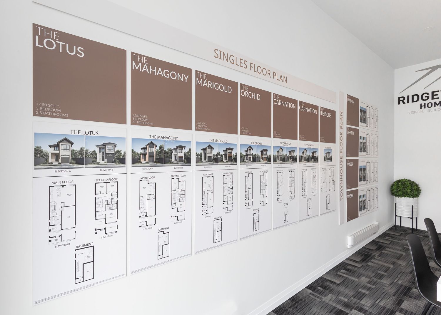 Long corridor showcasing architectural blueprints and design plans mounted on walls.