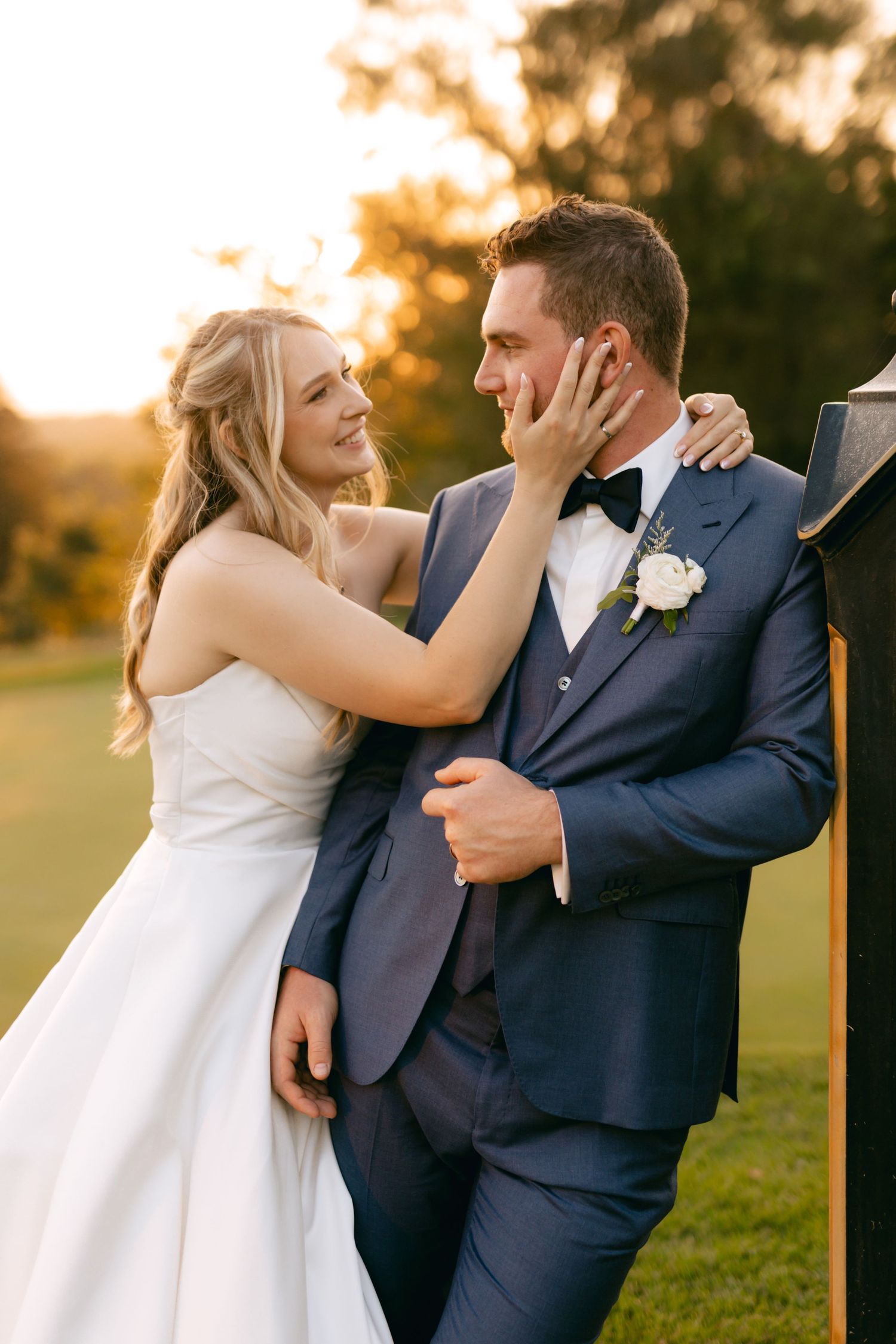 Candid wedding photos show couple sharing joyful moments during sunset portrait session.