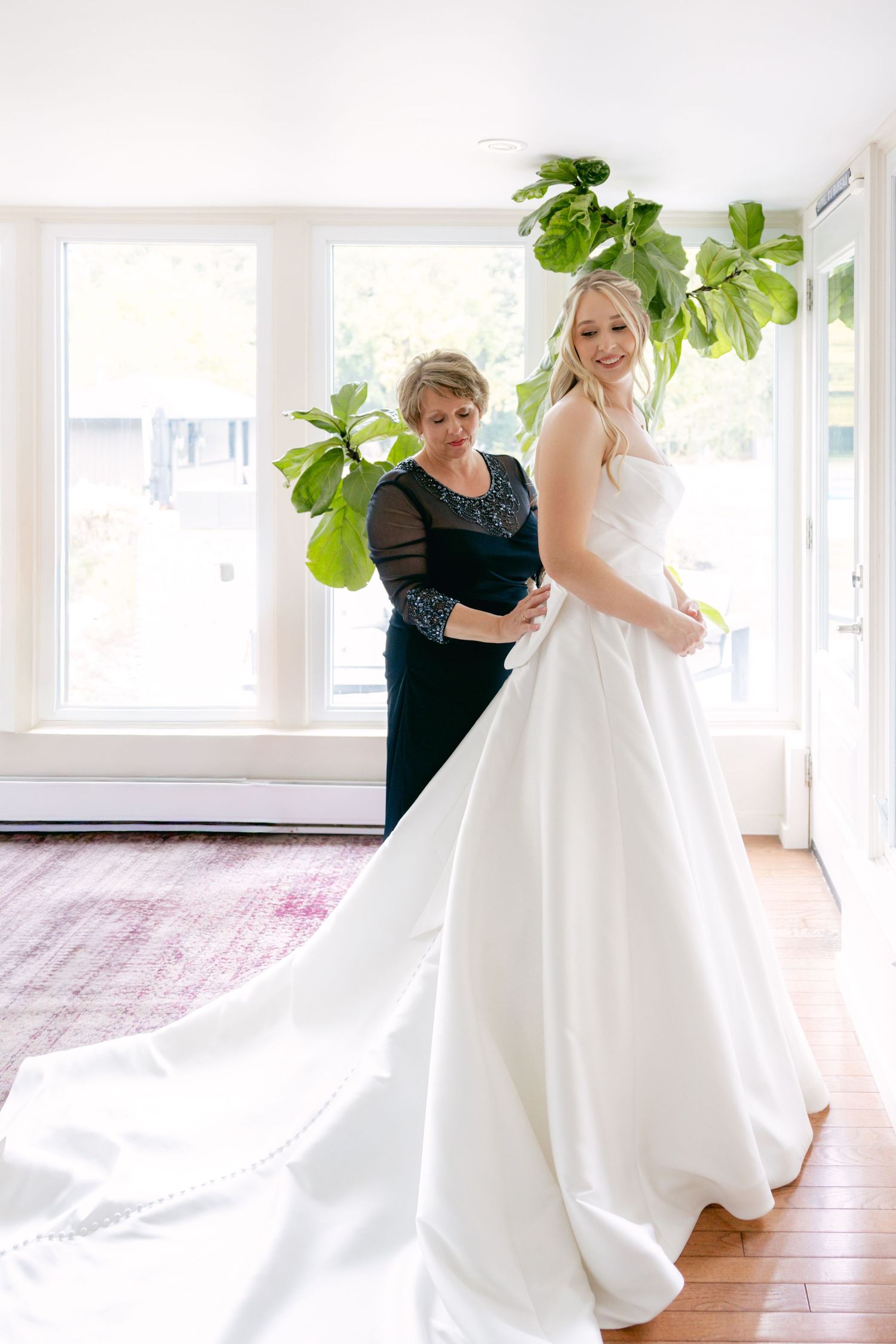 A sequence showing the elegant movement of a white wedding dress train across a bright indoor space.