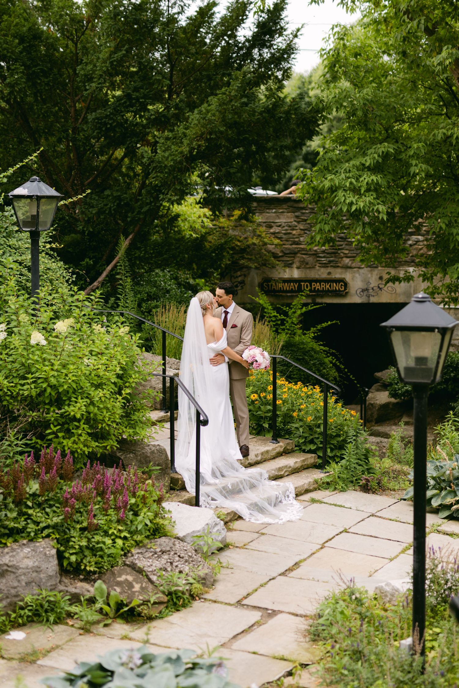 Romantic garden pathway photos with stone pavers and lush summer greenery.