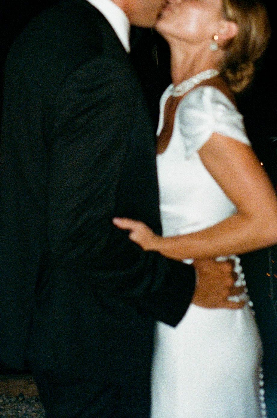 Romantic dance moment captured at an evening wedding reception.