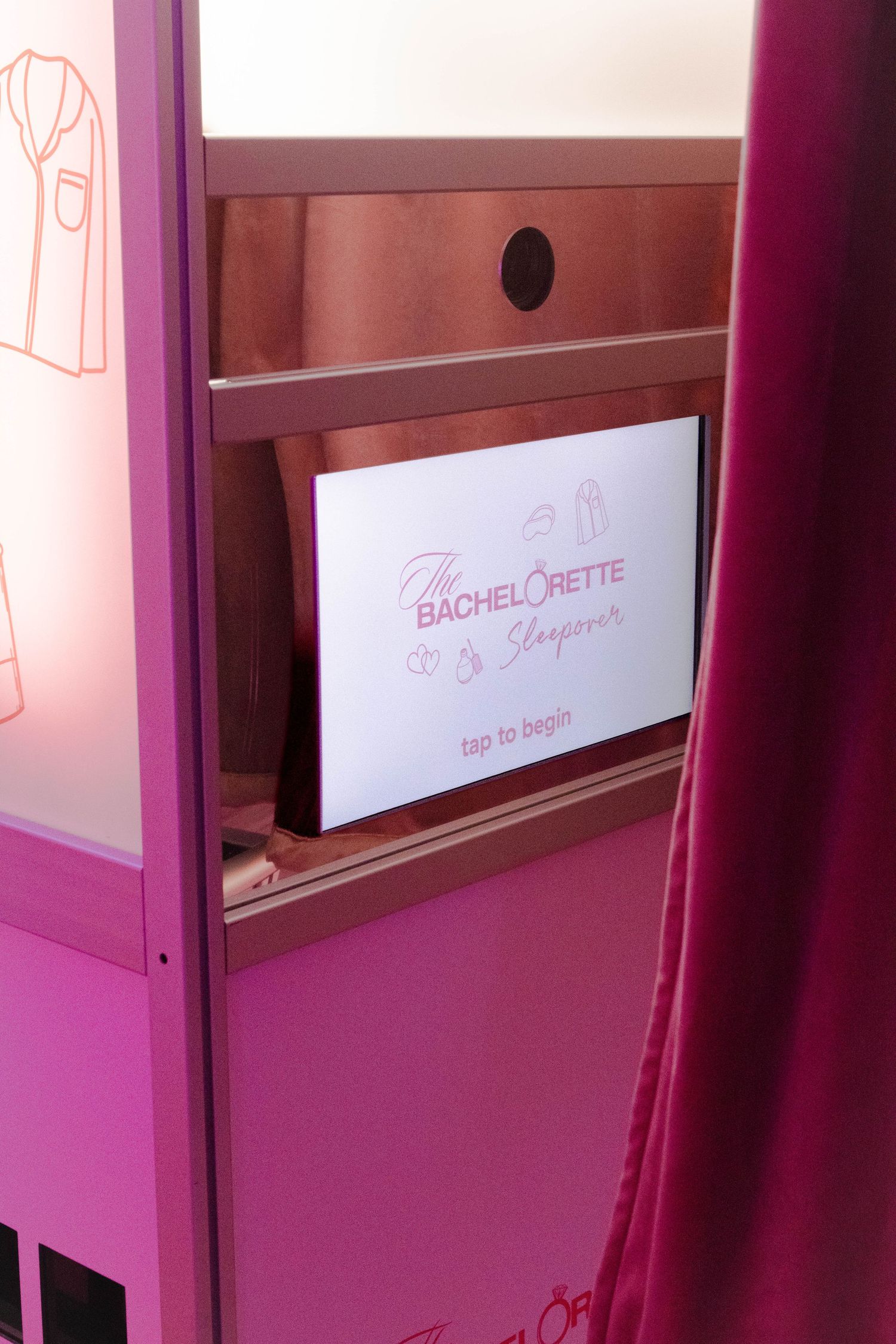 Pink-tinted room interior with white curtains and wooden furniture creating a romantic ambiance.
