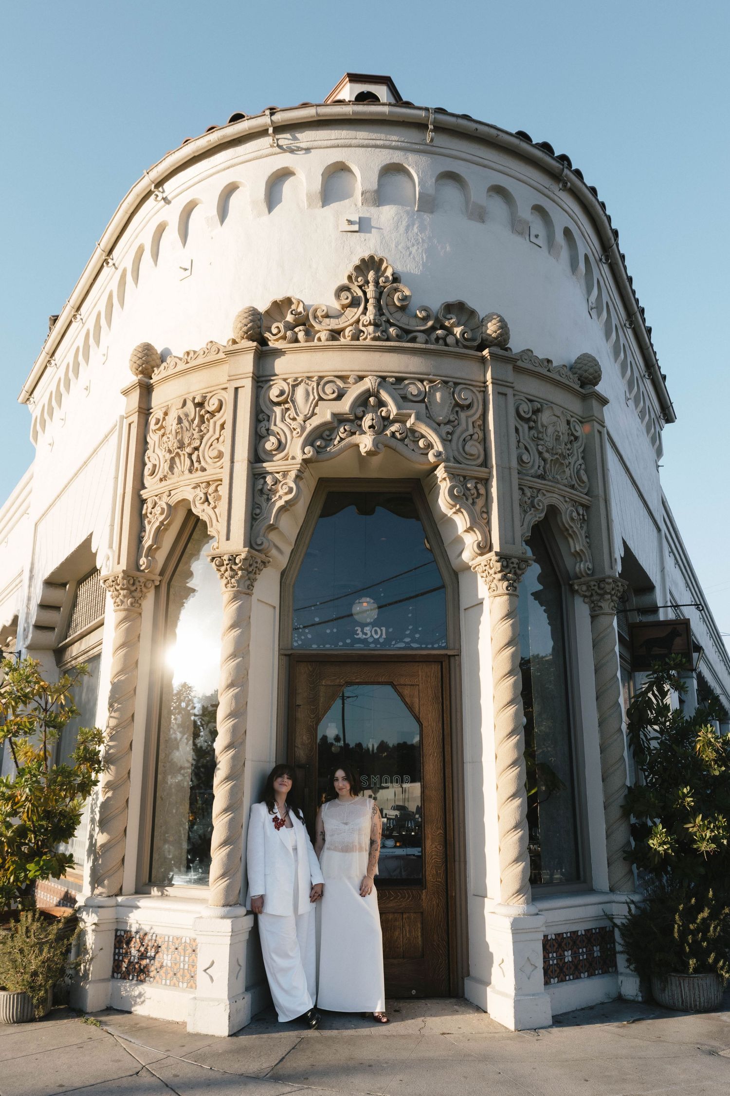 Ornate white architectural details of a building exterior with decorative columns and arches.