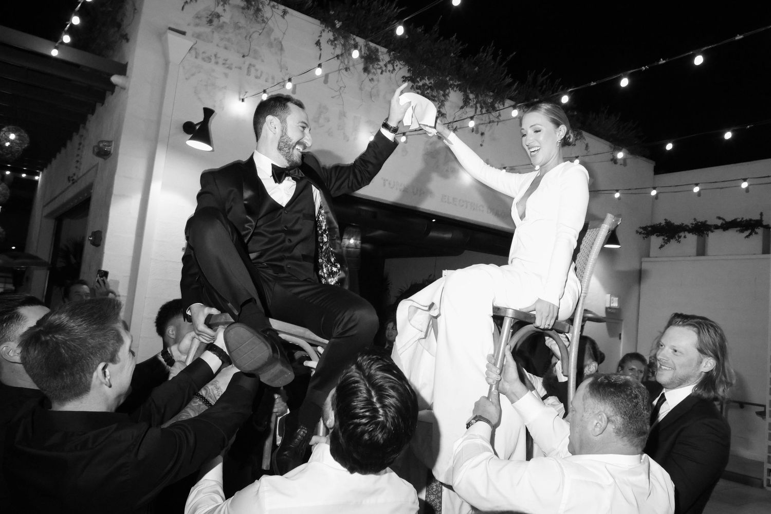 Black and white photos showing people dancing and celebrating at what appears to be a wedding reception.