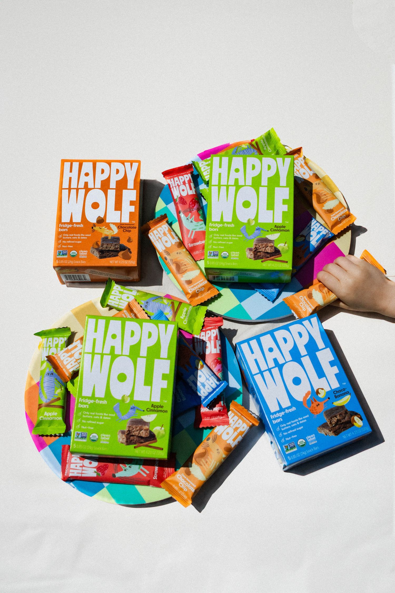 Collection of Happy Wolf branded snack boxes displayed on white background.