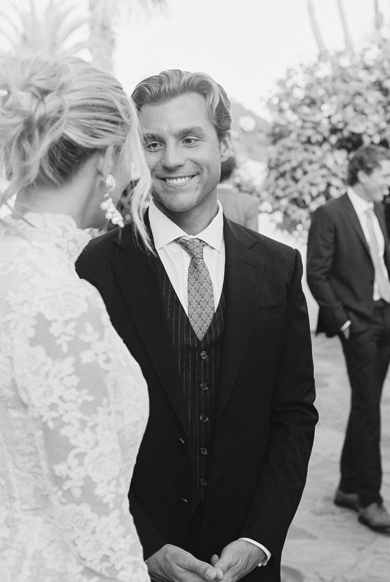 Black and white wedding photos showing tender moments between a couple.
