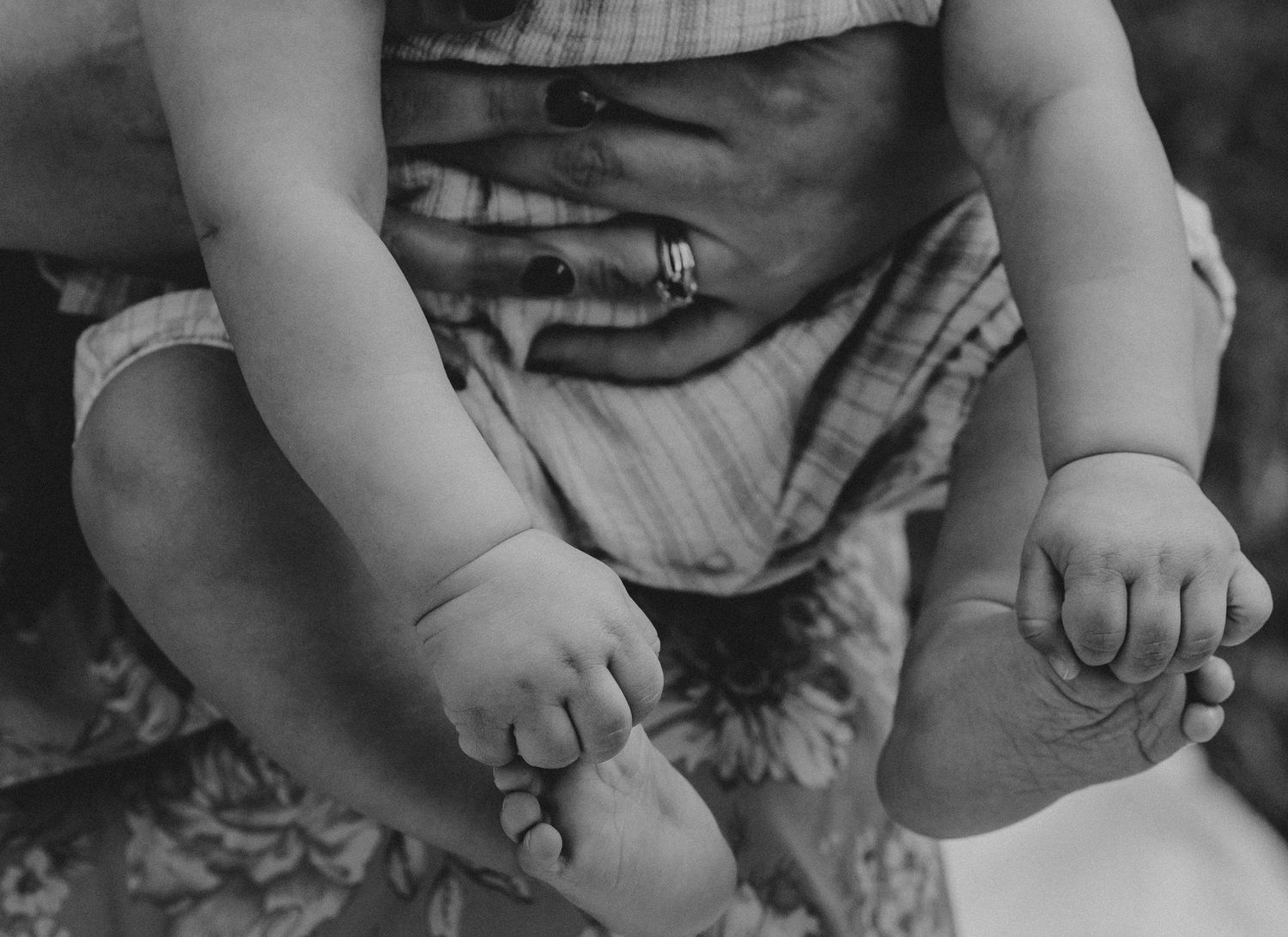 Black and white newborn detail of baby feet. Honest motherhood photography in Macon, GA by C + F Photography.