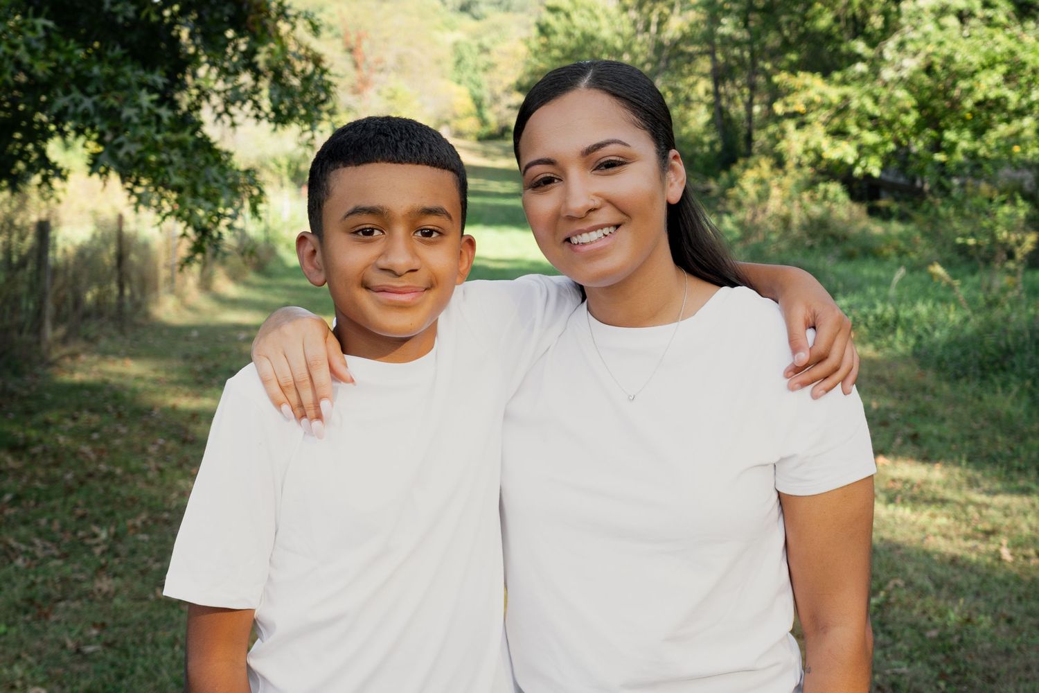 A series of outdoor portrait photos showing joyful expressions and white t-shirts against a natural background.