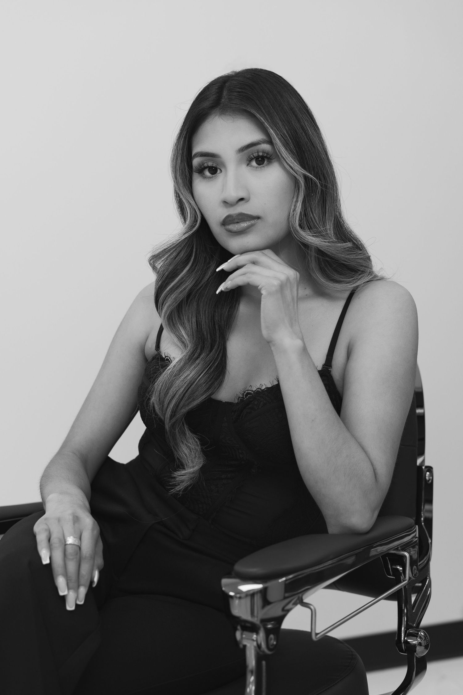 Black and white Branding portrait series showing elegant poses in a minimalist studio setting.