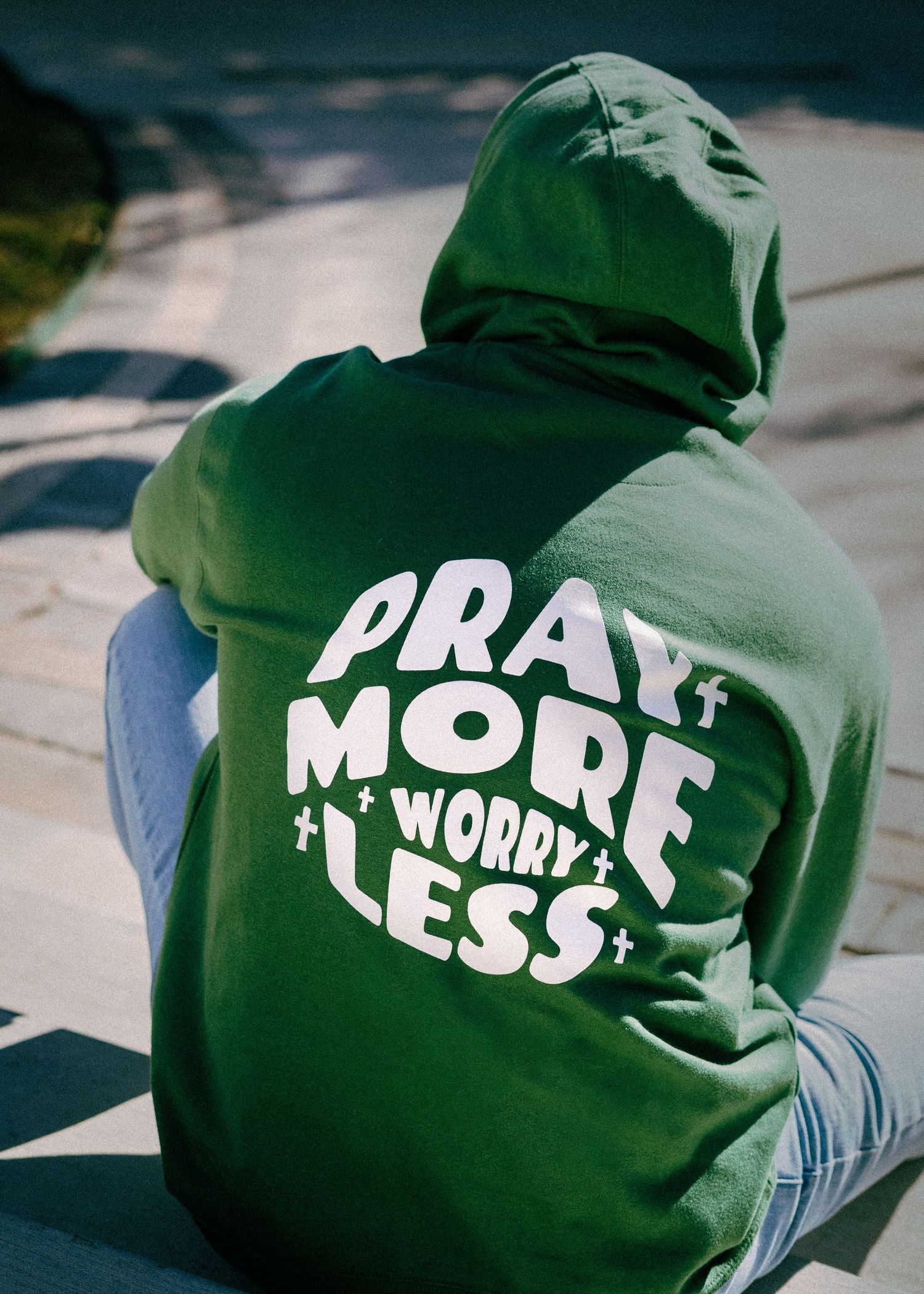 Branding green hoodie with white text messages displayed in sequence.