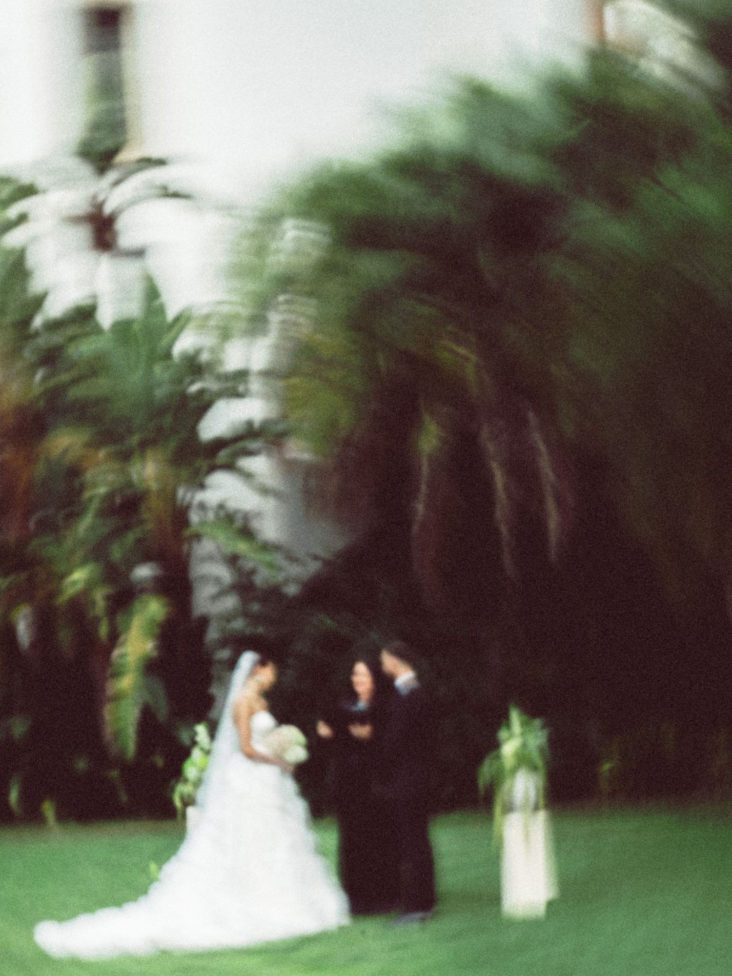 Eastern European couple in a ceremony at Santa Barbara Courthouse; film-inspired; San Francisco Bay Area; Mandarin, Cantonese, English.