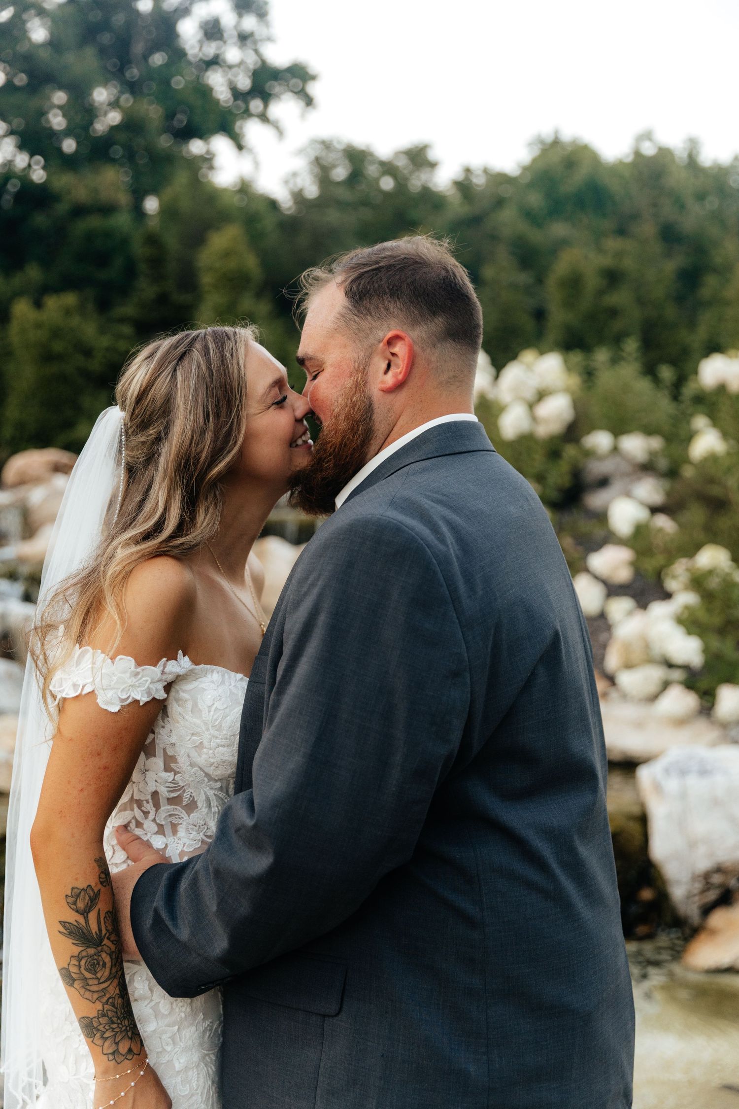 Romantic wedding couple sharing an intimate moment outdoors during their special day.
