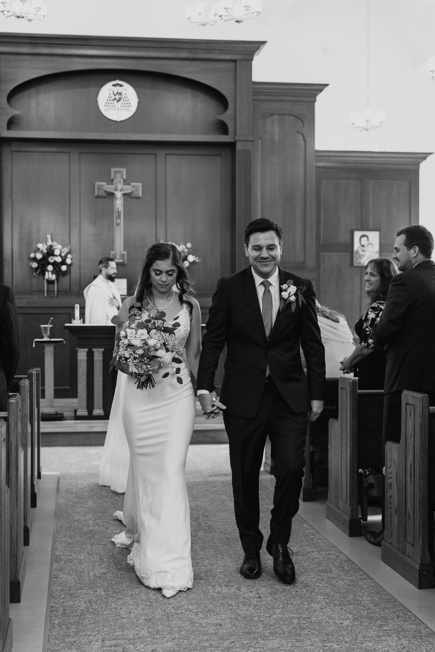 Black and white photos of a wedding recessional down the church aisle.