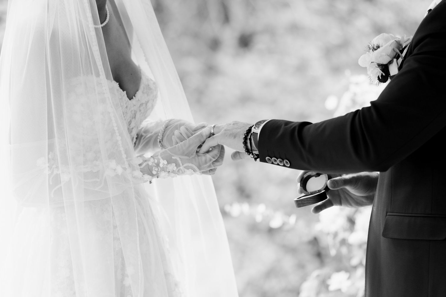 Close-up details of white wedding dress and veil preparations.