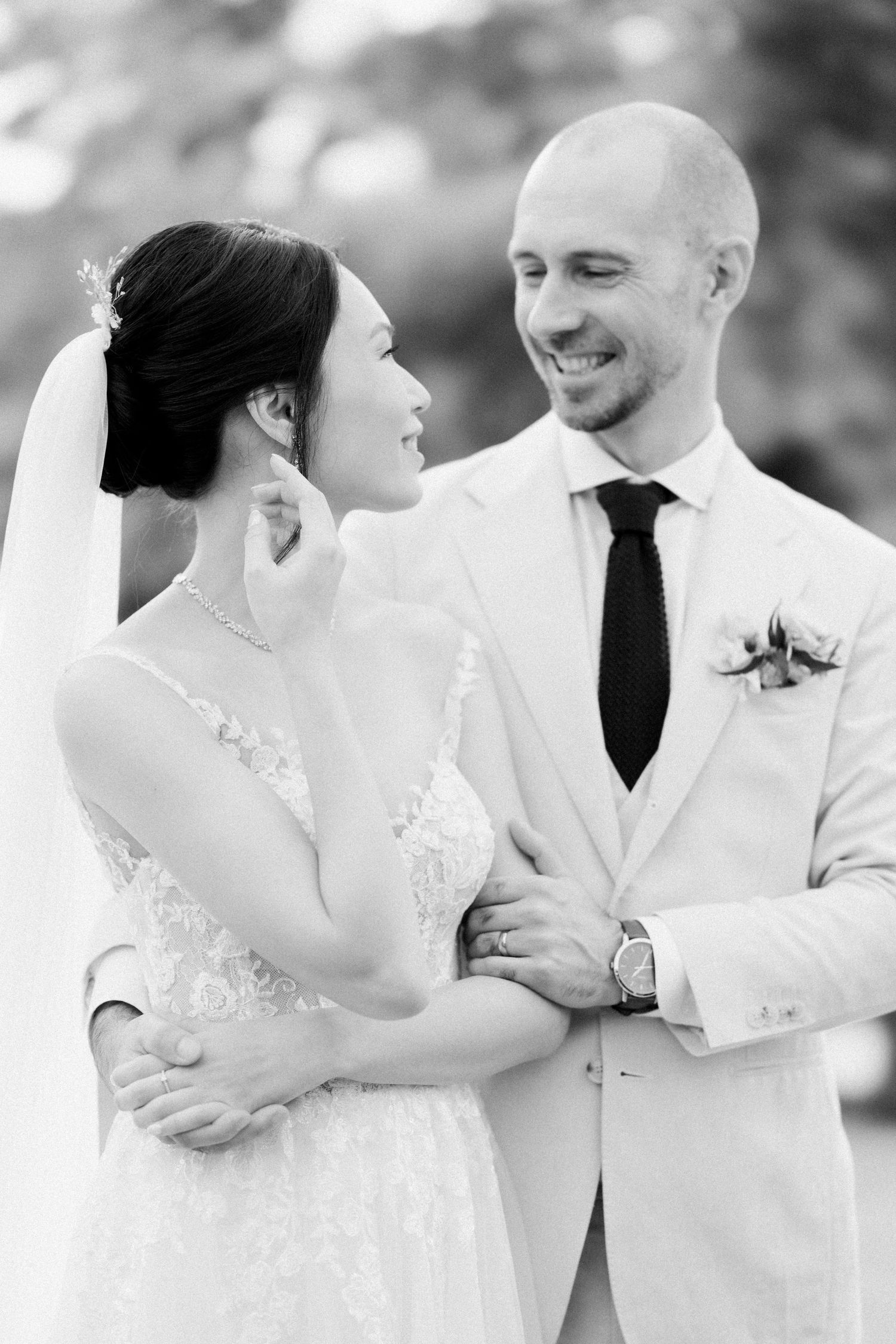 A romantic black and white photo sequence of a bride and groom sharing tender moments on their wedding day.
