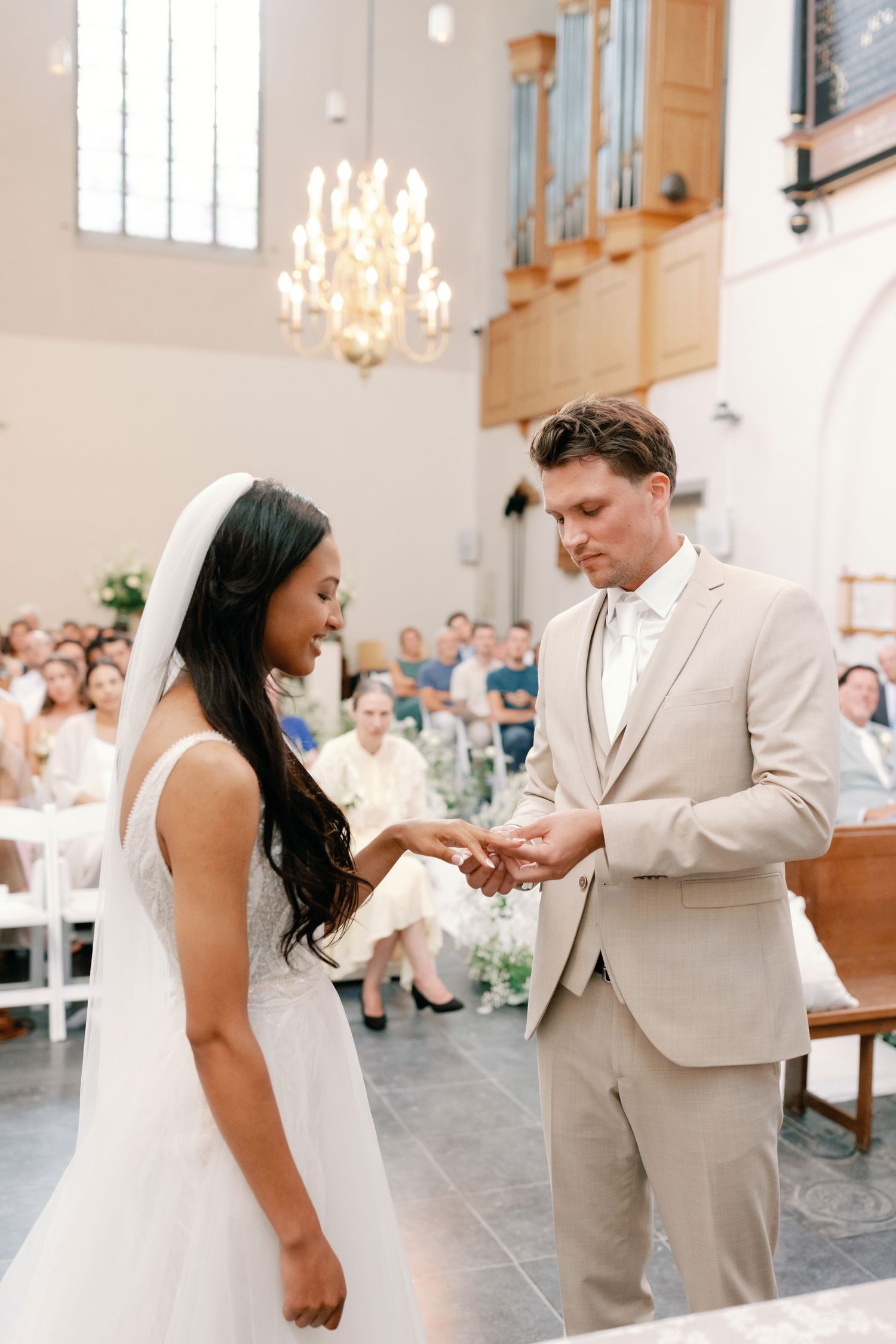 A romantic sequence of wedding ceremony moments showing a couple exchanging rings in an elegant church setting.