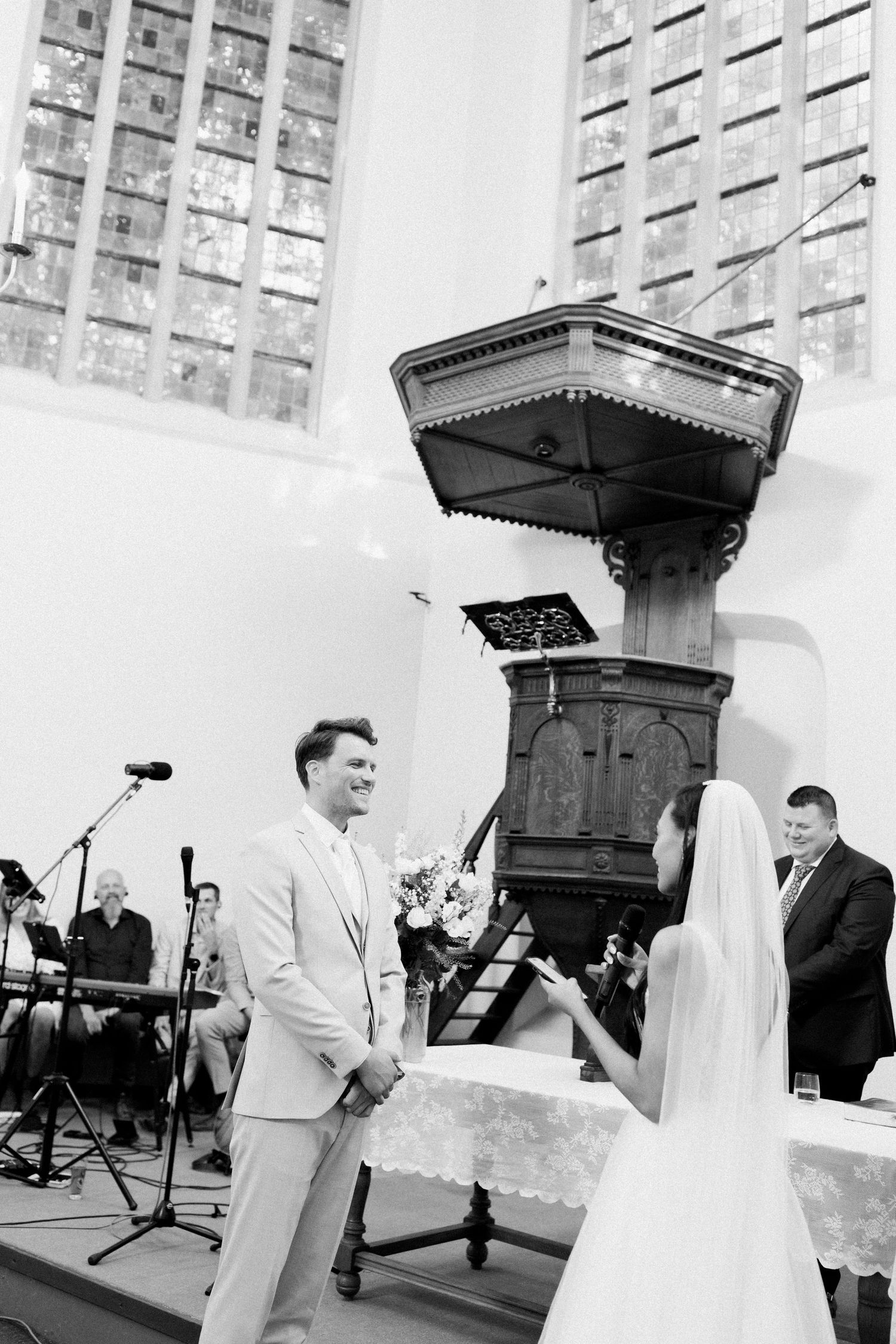Black and white photo series showing a wedding ceremony with guests gathered in a church setting.