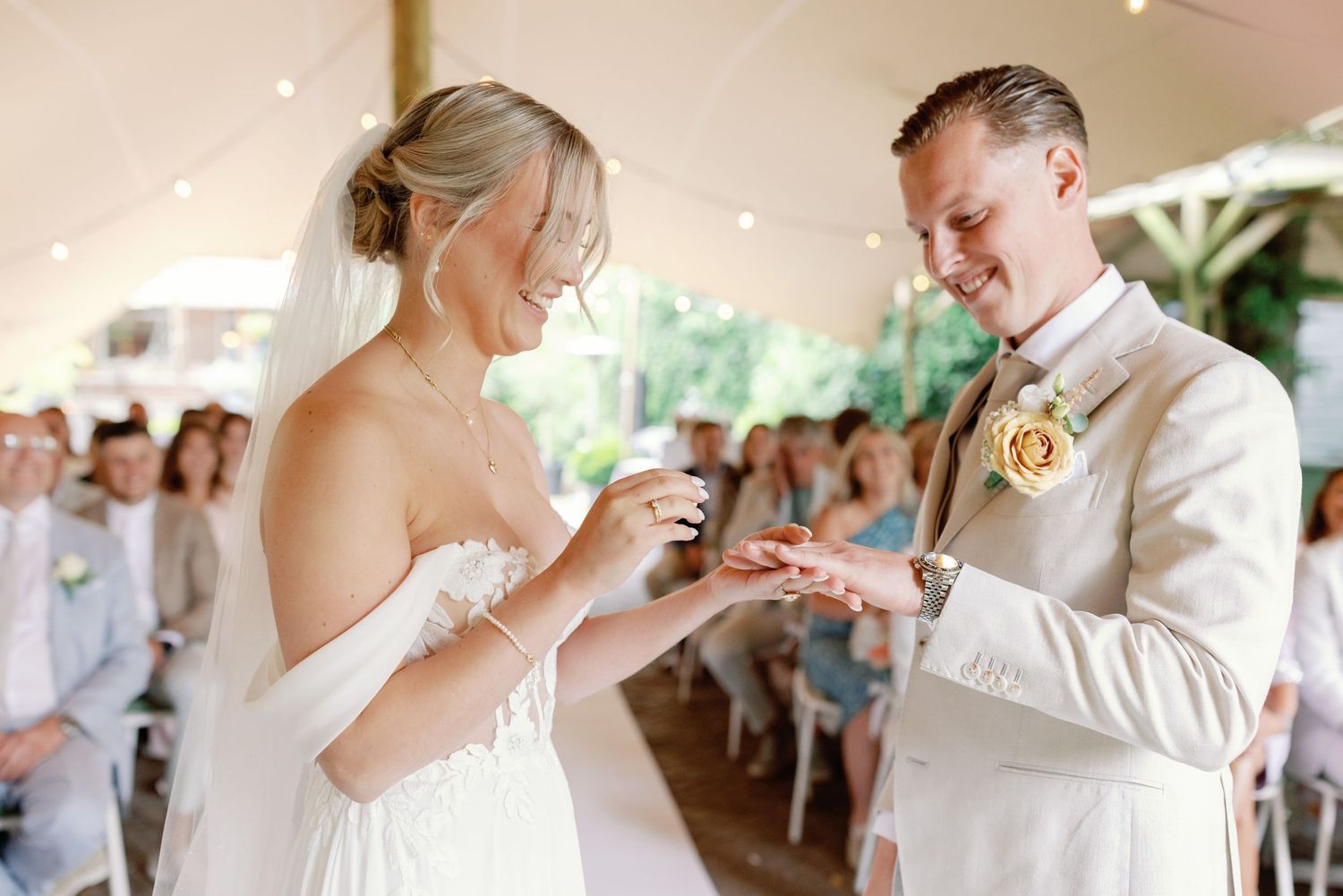 A sequence of wedding reception moments showing guests and newlyweds celebrating under an outdoor tent.