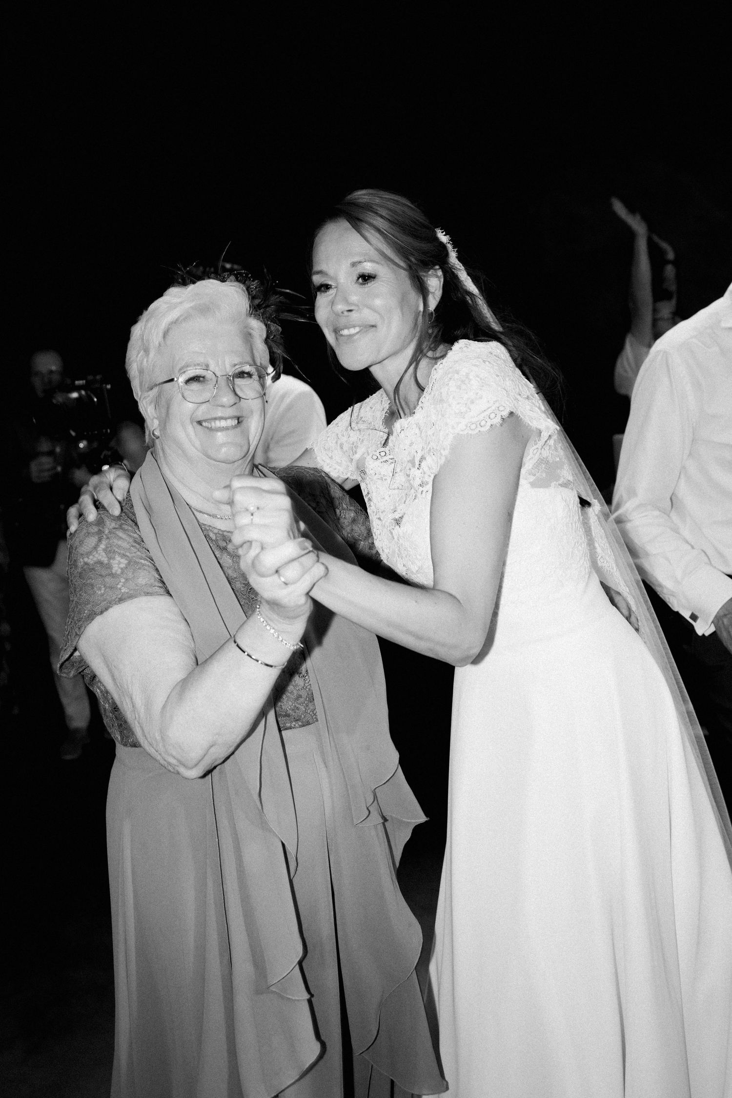 Black and white photos show a heartwarming dance sequence between two people at what appears to be a wedding reception.