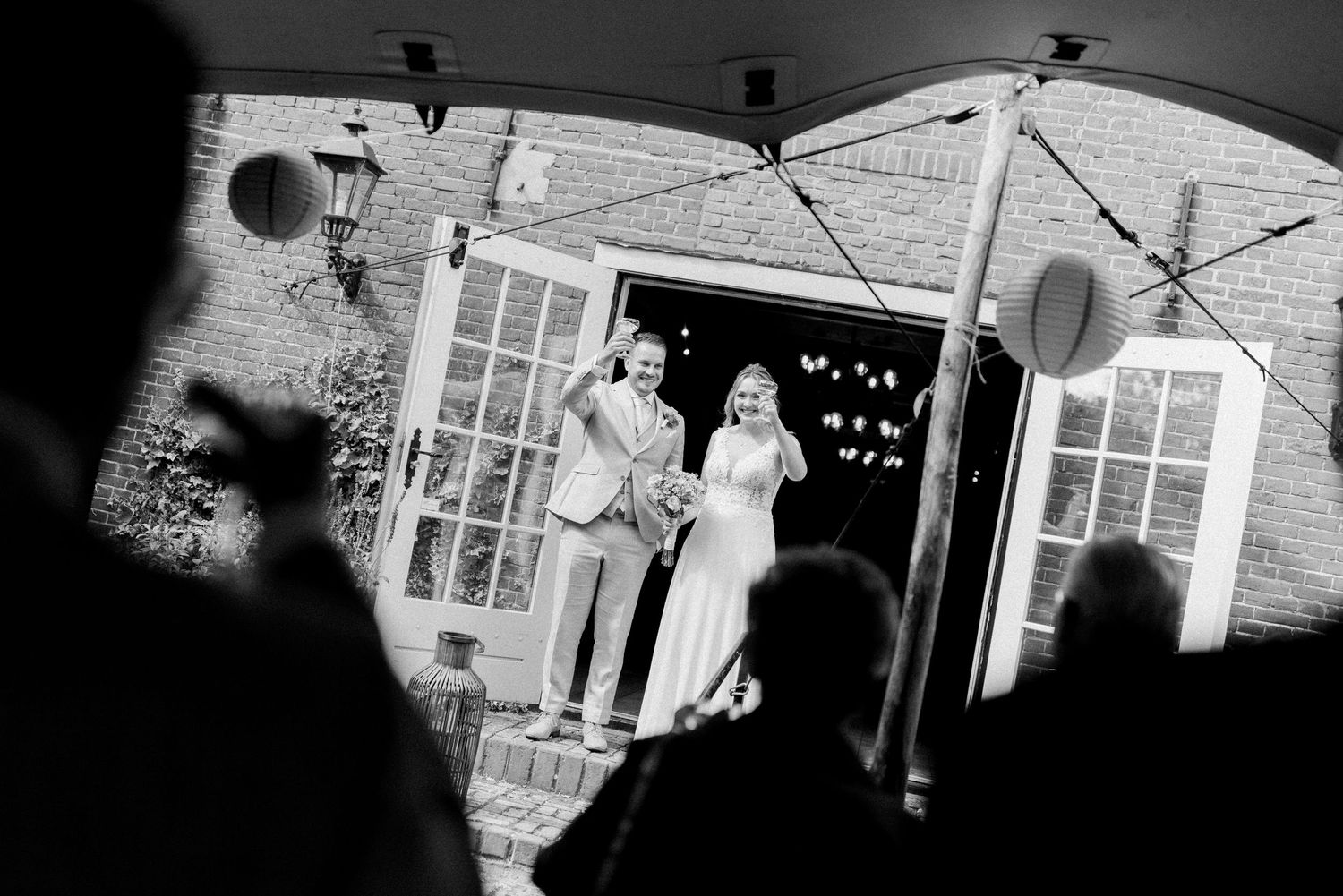A black and white photo series showing different moments of a traditional wedding ceremony and celebration.